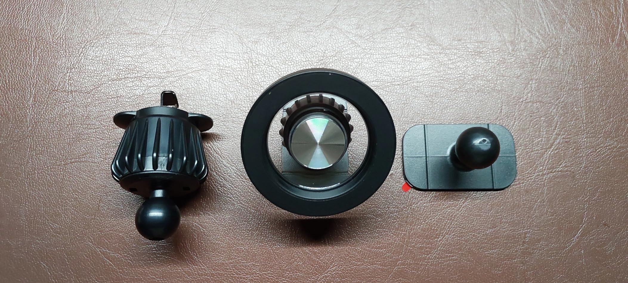 All MagSafe car mount parts laid out on a table