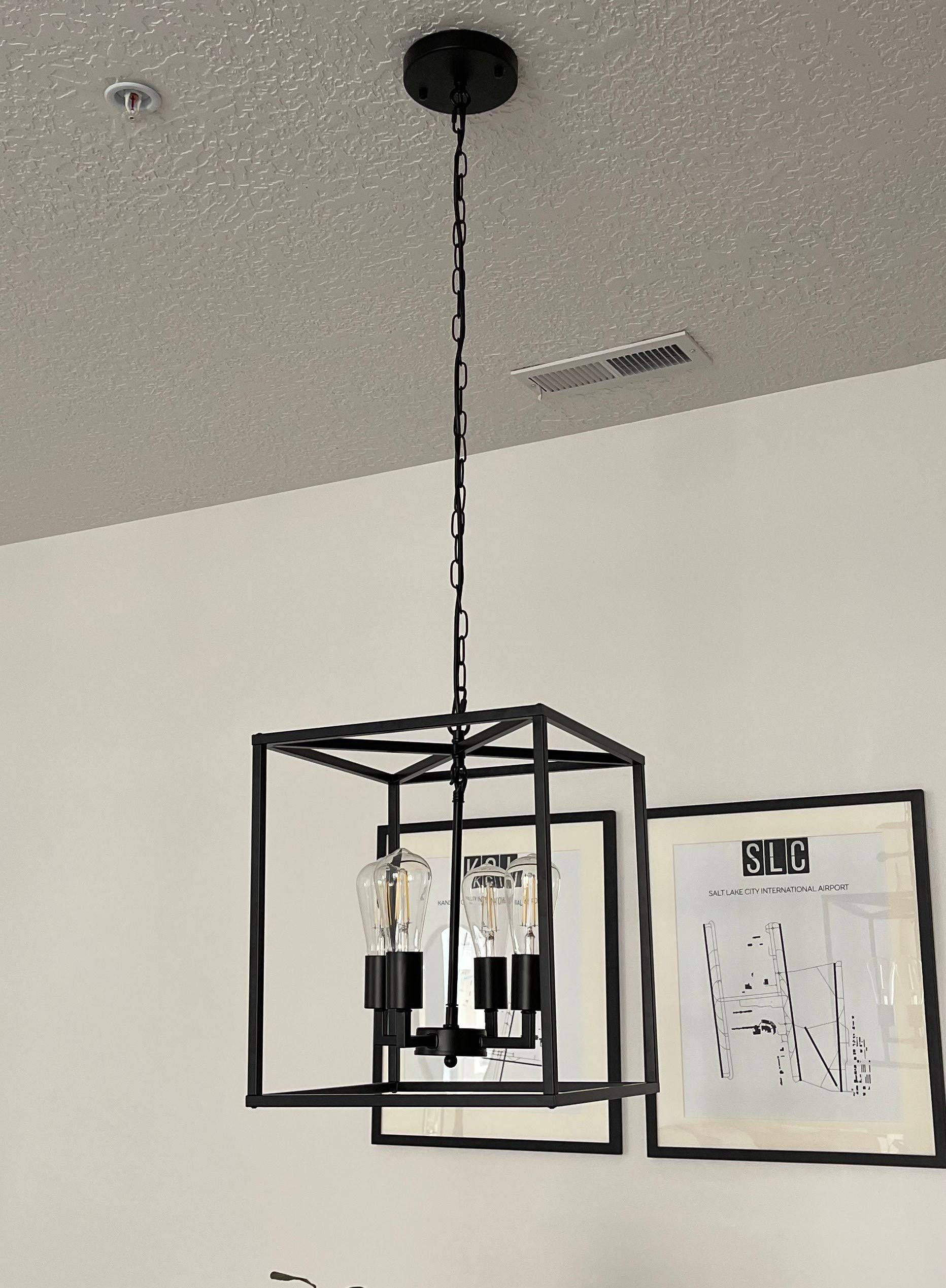 4-Light Industrial Metal Farmhouse Chandelier Black Lantern Pendant Light Hanging Light Fixture For Kitchen Island Living Room Foyer Dinning Room Bedroom