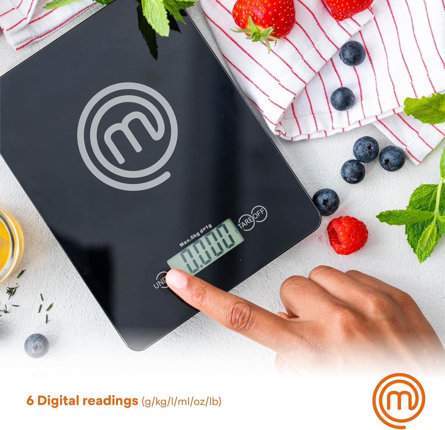 Hand pressing the UNIT button on the MasterChef Digital Food Scale, showing multiple unit options