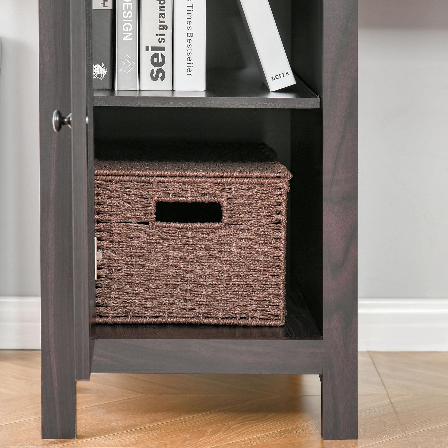Open bottom cabinet of the desk, revealing interior shelves and storage space.