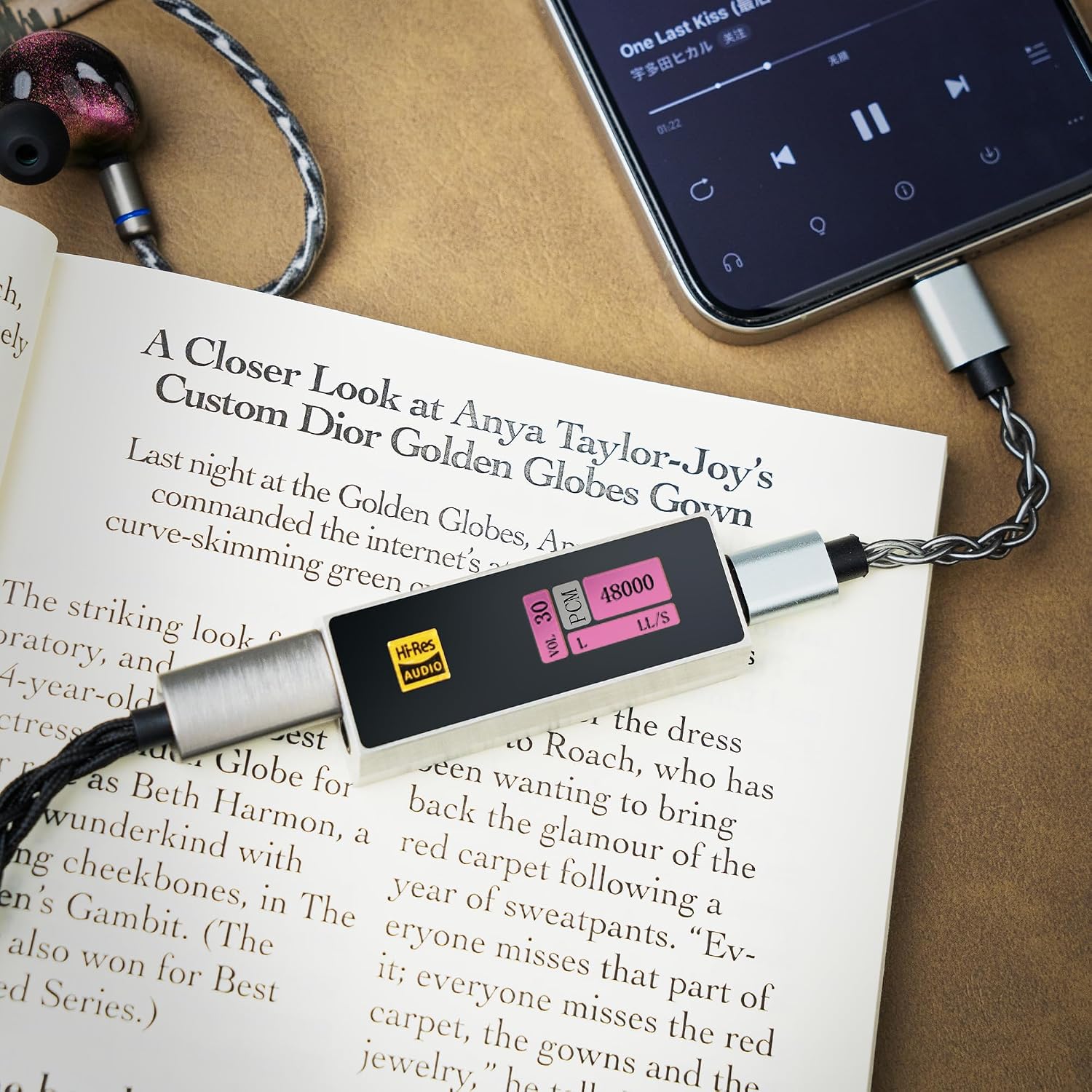 iBasso Audio DC04U connected to a smartphone, displaying audio information