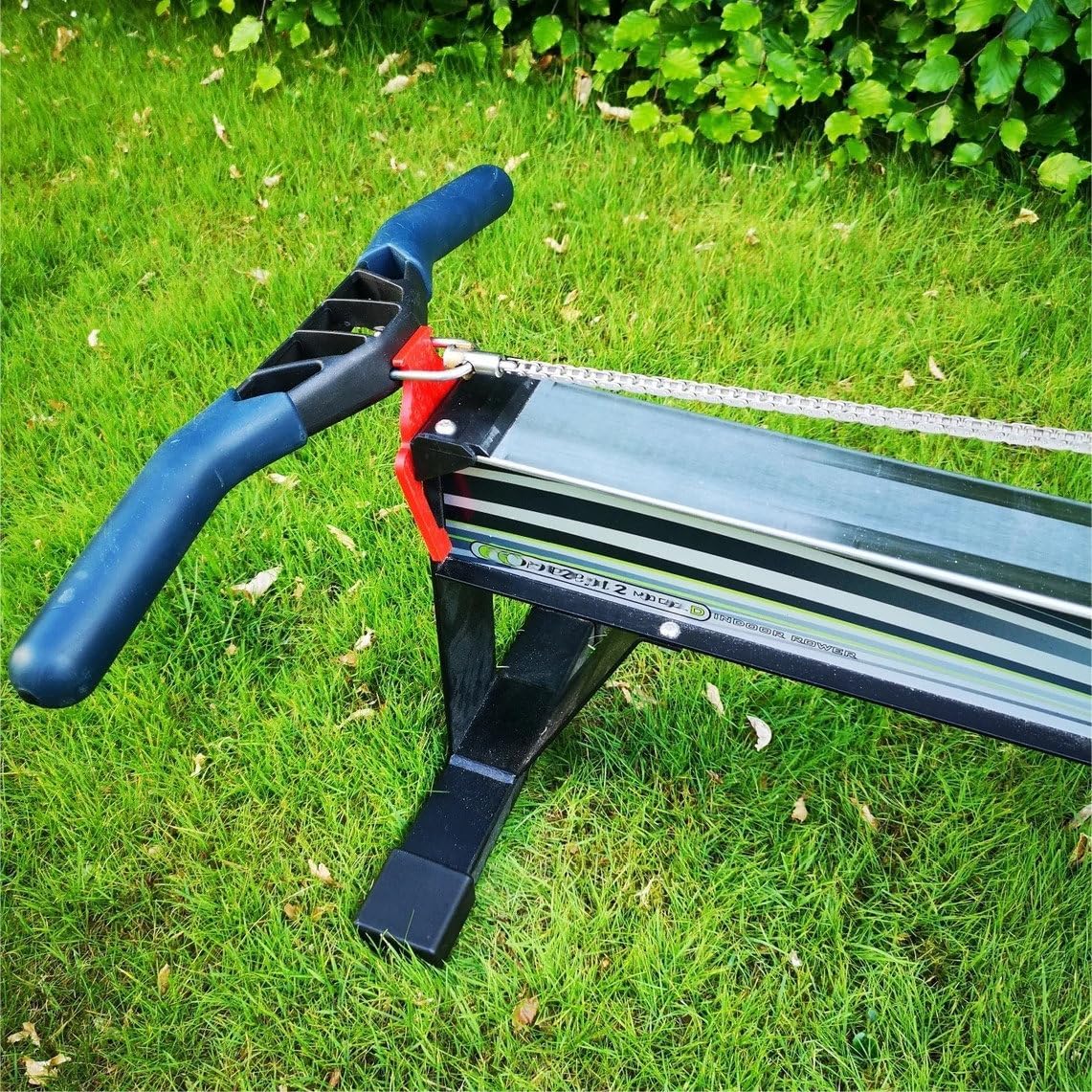 Ergtab handle holding a Concept2 rower handle in an extended position on a grassy lawn.