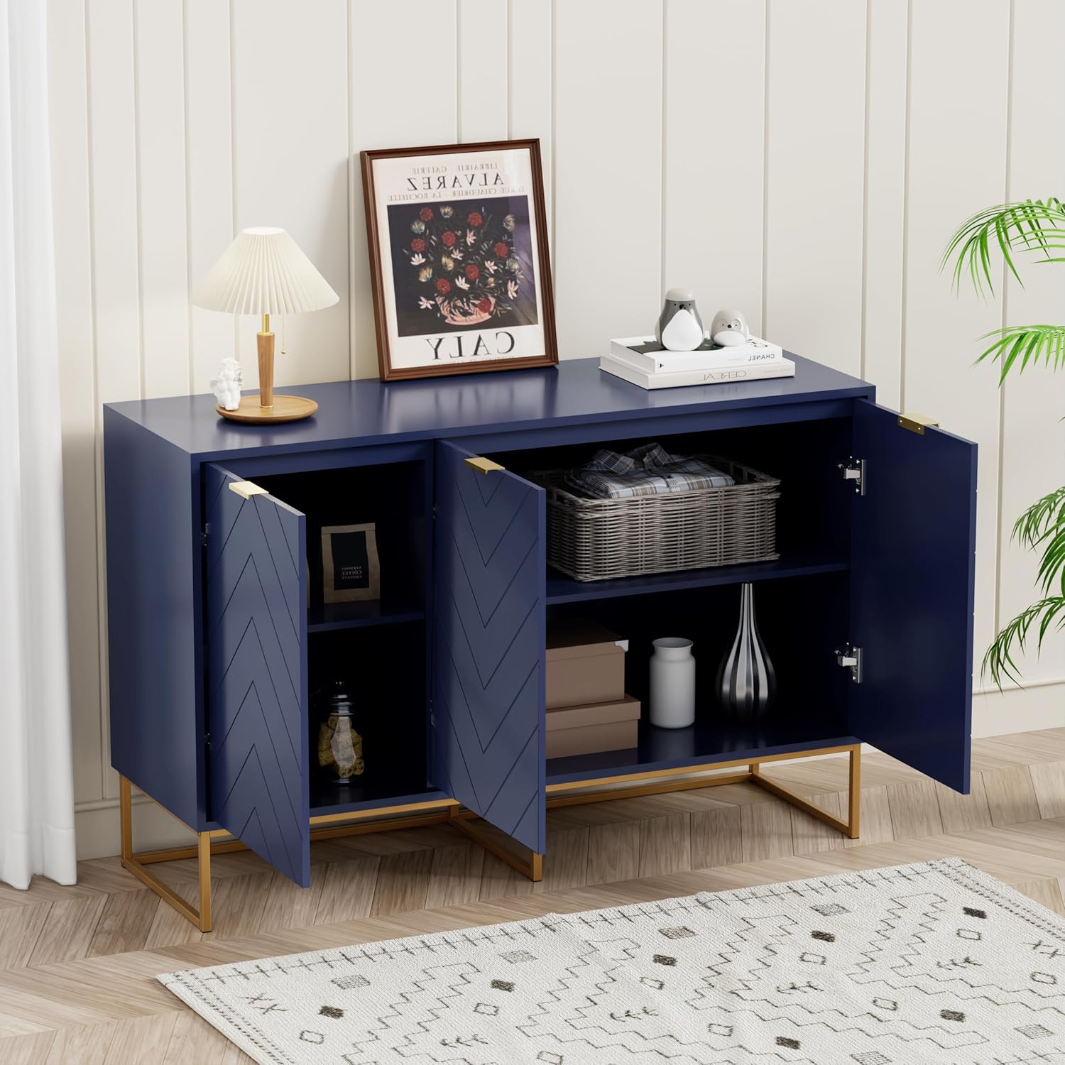 Innere view of the Scurrty sideboard cabinet with doors open, showing adjustable shelves and stored items.