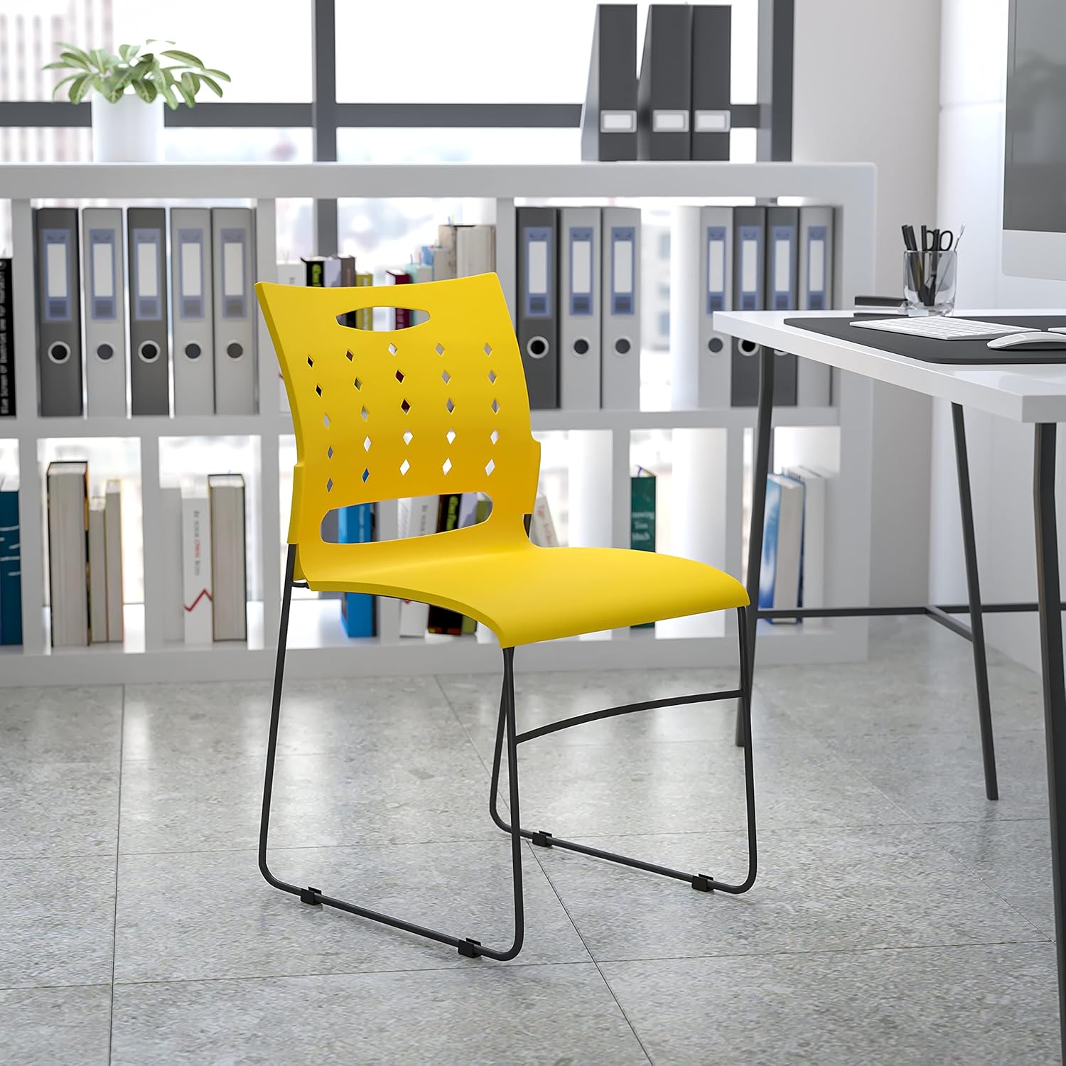EMMA + OLIVER 881 lb. Capacity Yellow Sled Base Stack Chair with Air-Vent Back