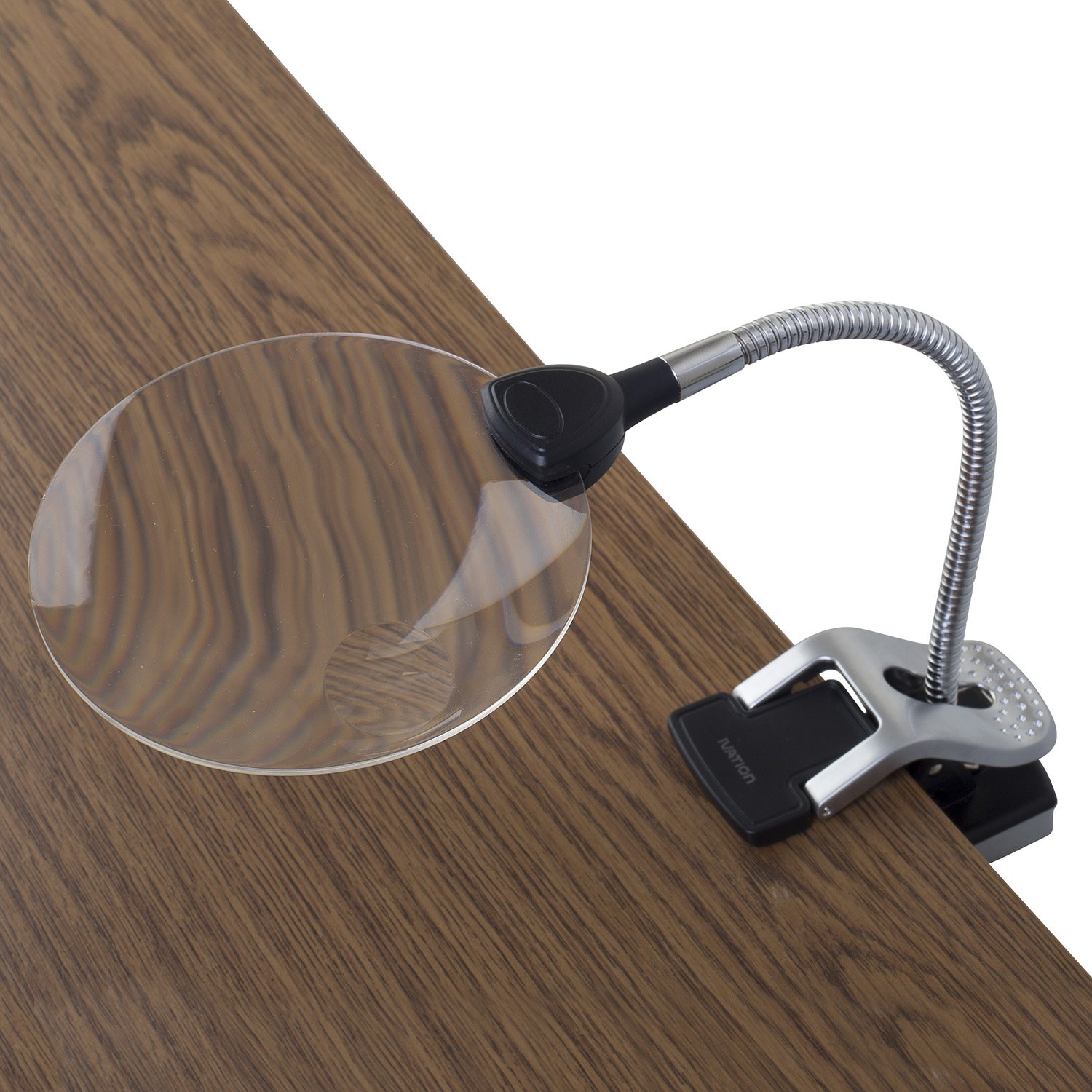 Ivation LED Magnifier in freestanding mode on a wooden desk