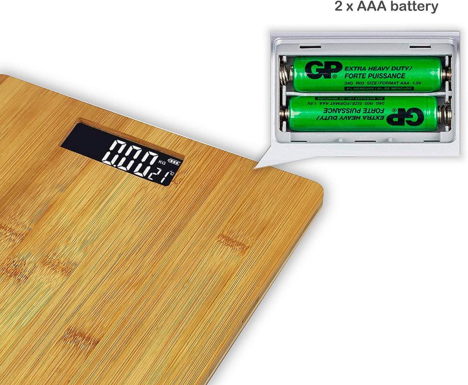 Avvicinamento view of the battery compartment on the underside of the scale, showing two AAA batteries inserted