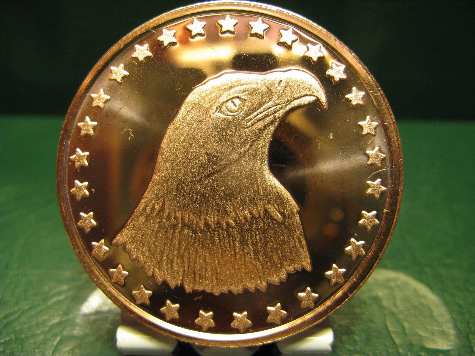 KWG Bald Eagle , 1 oz fine copper 39 mm rounds, has some very fine ( almost invisible) scratches but otherwise in very nice bright condition . supplied in BCW vinyl coin pocket