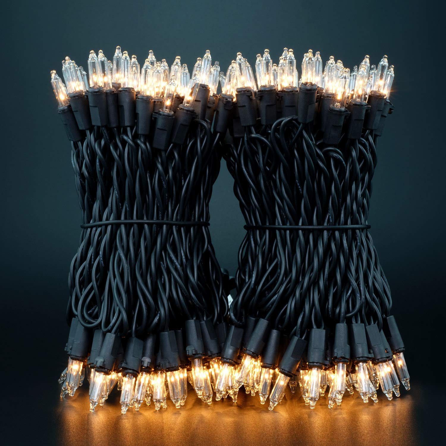 Luces de Navidad transparentes con cable negro, paquete de 2 juegos de 100 luces navideñas de 33 pies con certificación UL (transparente, cable negro) 9
