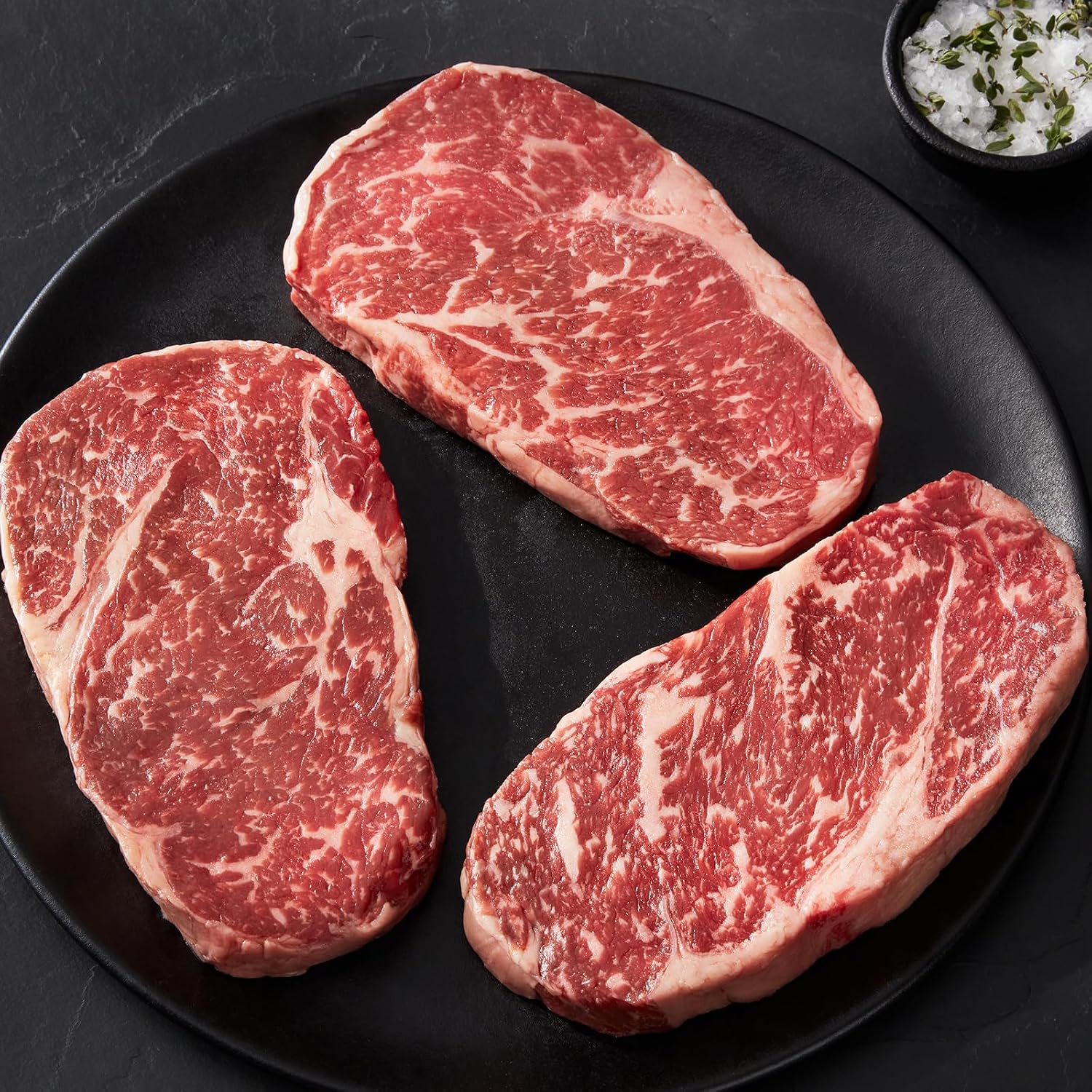 Premium Center-Cut American Style Kobe Beef Ribeye Steaks, 8 count, 12 oz each - Unmatched flavor and juiciness, with cooking instructions from Kansas City Steak Company.