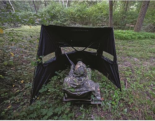Vista 18 de ALPS OutdoorZ Silla de caza plegable High Ridge con mesa auxiliar para acomodar llamadas y ataques, bolsillo repelente de insectos y bolsa de Madera