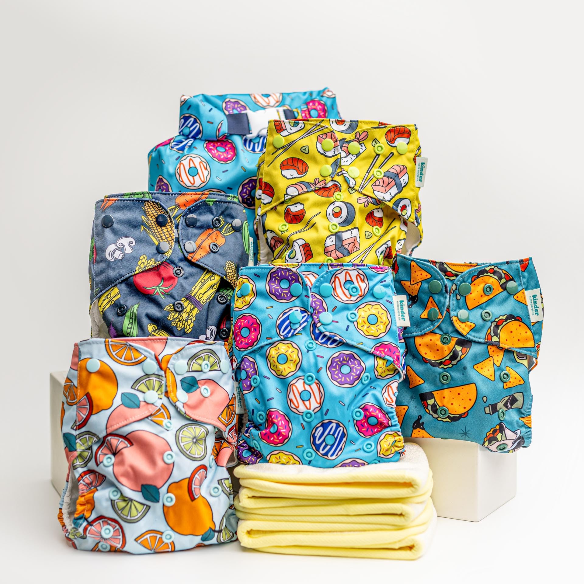 Photo 1 of Kinder Cloth Diapers Set of 5 Reusable Baby Diapers Pocket Style Athletic Wicking Jersey, Bamboo Viscose Inserts, Wet Bag, Newborn to Potty Training 7-60lbs, One Size (Foodie)