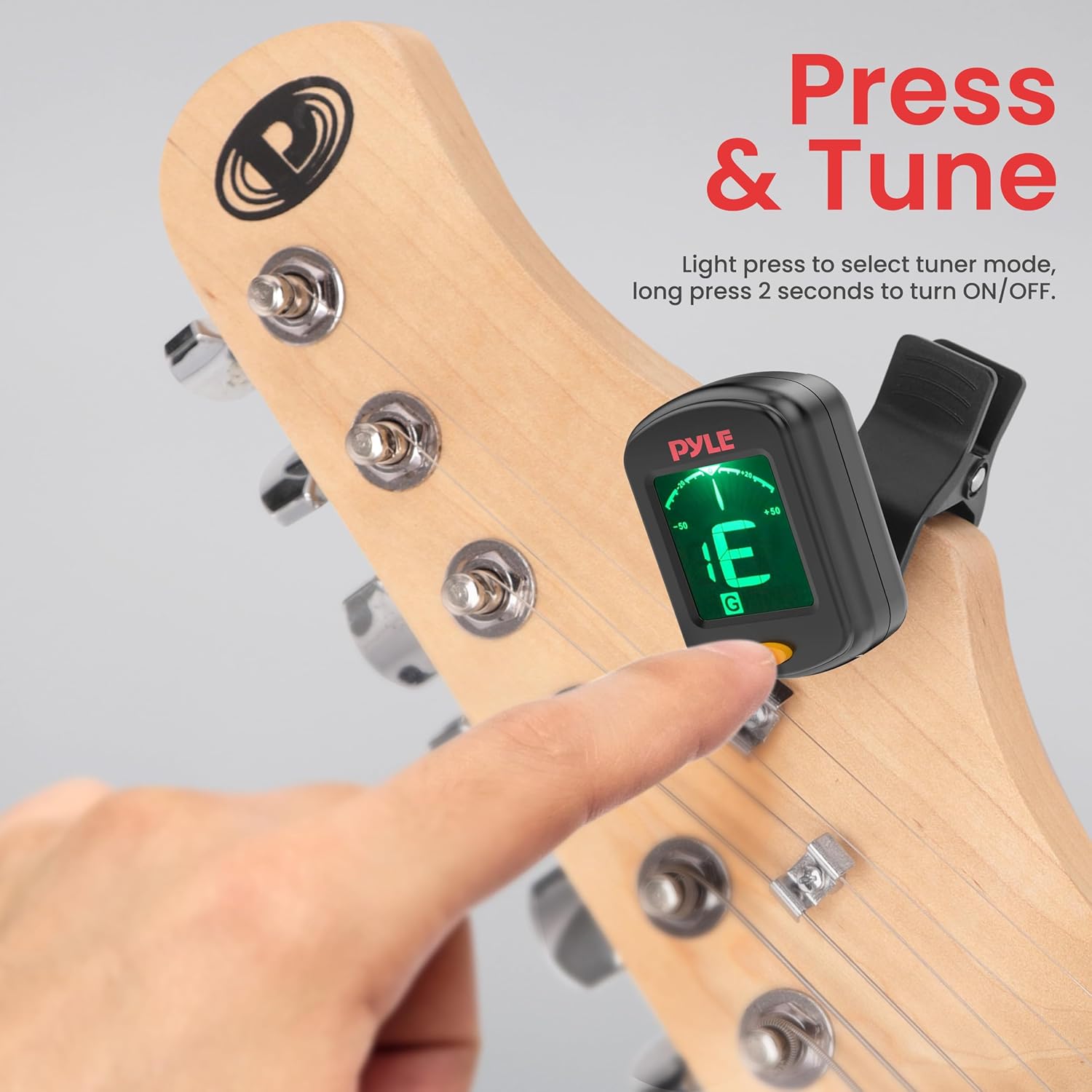 A finger pressing the power button on the Pyle Digital Clip-On Chromatic Tuner, indicating how to turn it on or off