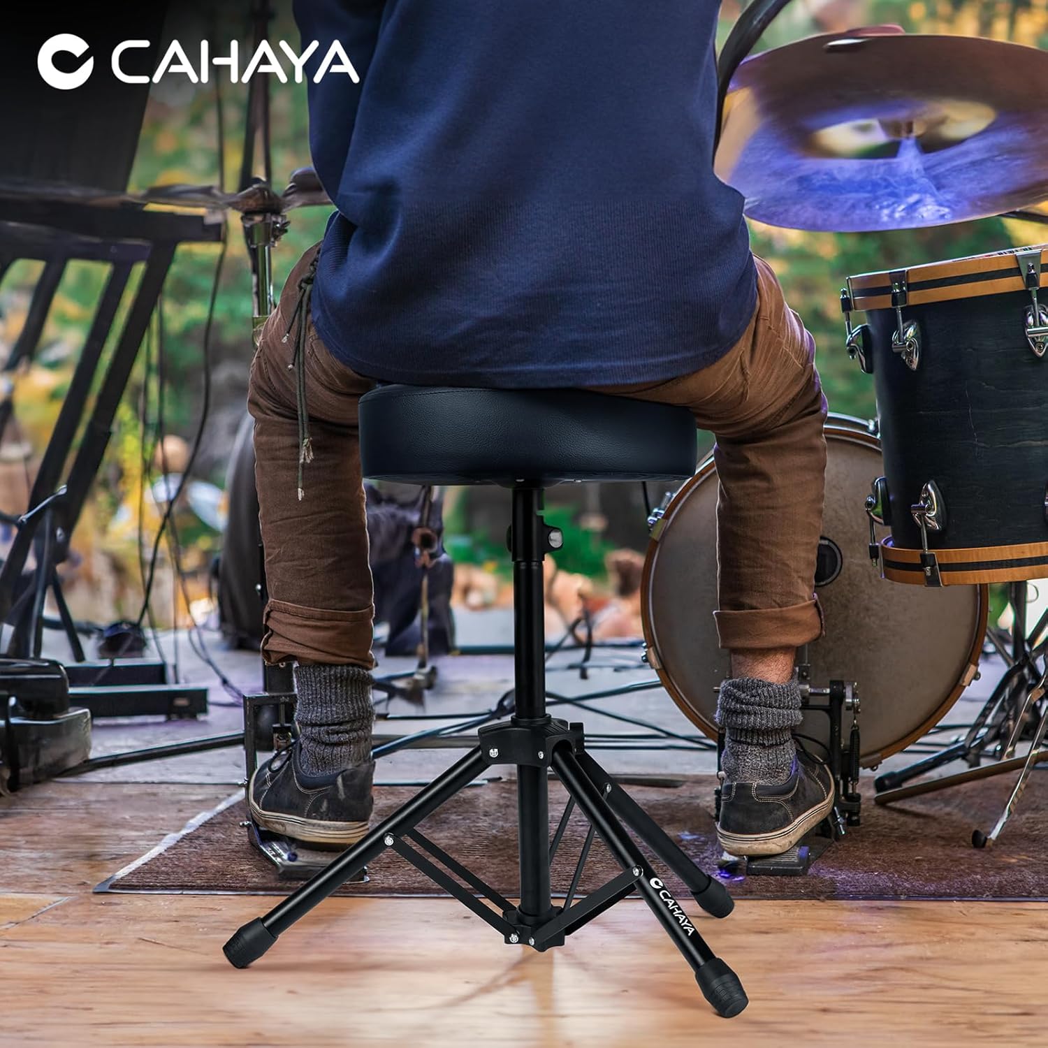 Person seated on the CAHAYA CY0334 Drum Throne while playing drums
