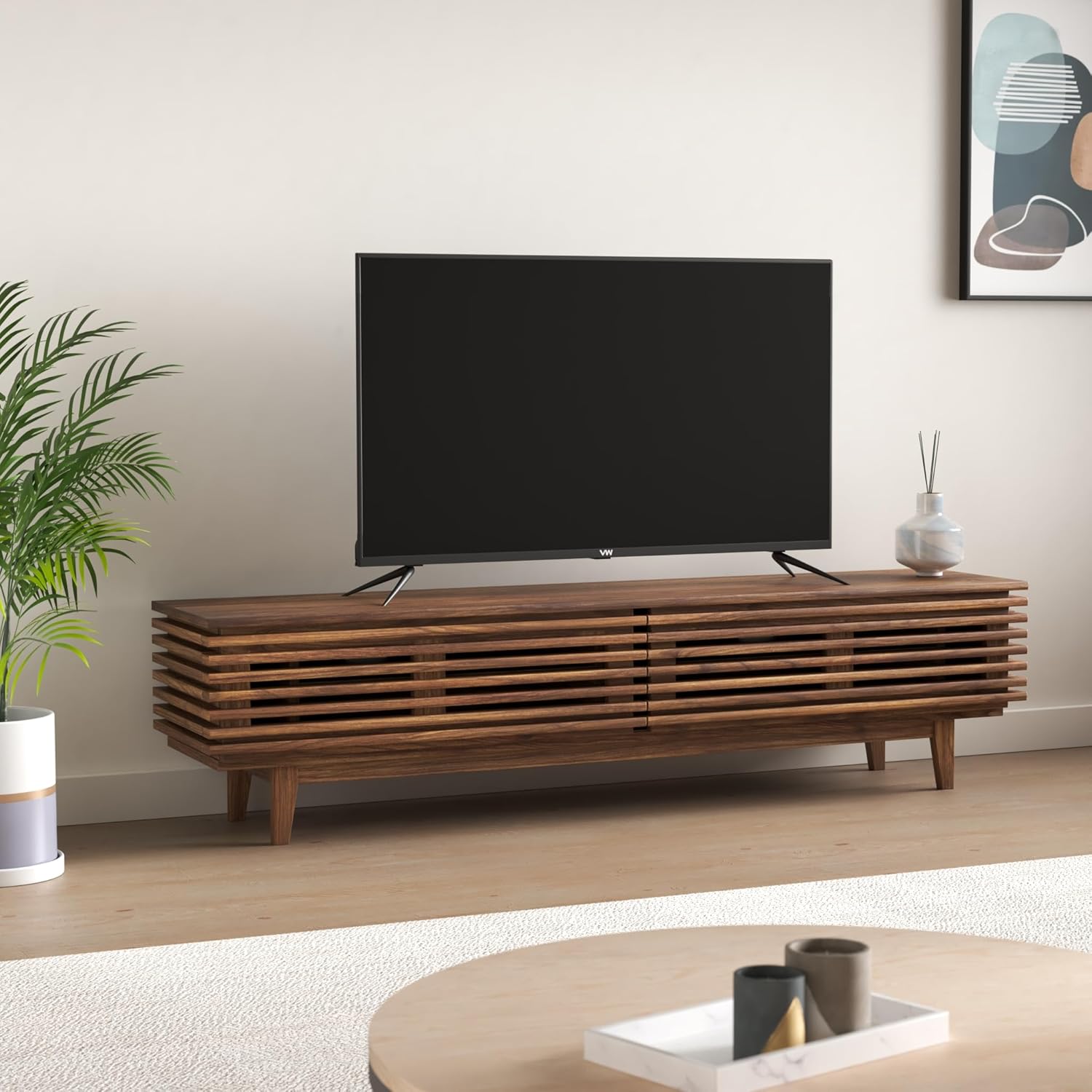 VW 43-inch QLED TV on a TV stand