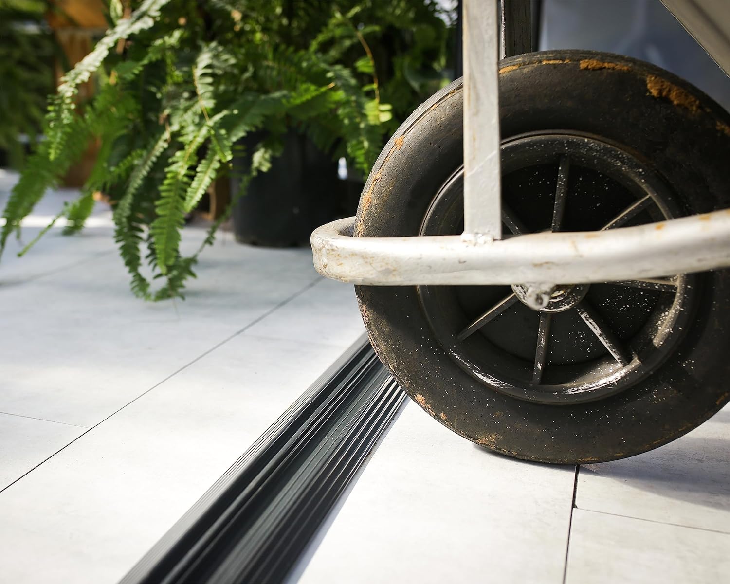 Close-up of the door latch mechanism on the greenhouse