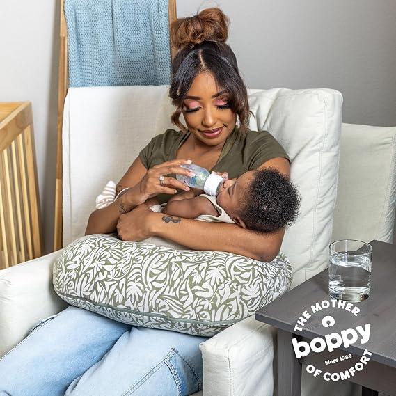 Boppy Nursing Pillow - Ergonomic Bottle & Breastfeeding Pillow, Higher, Firmer & Larger, Water-Repellent with Washable Organic Cotton Cover, Baby Safety Alliance Verified - Green Cut Out Leaves