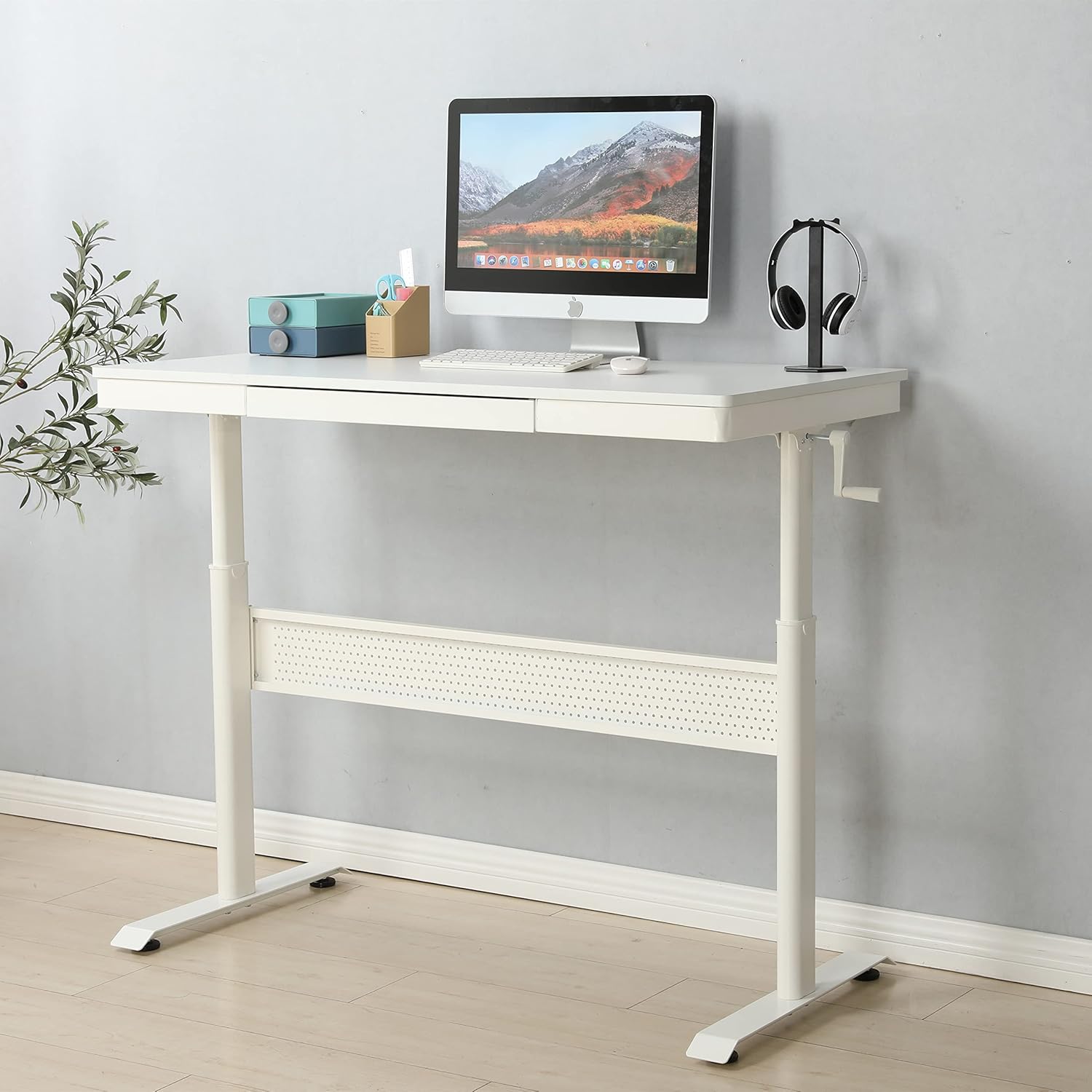 Standing desk with crank handle visible on the side