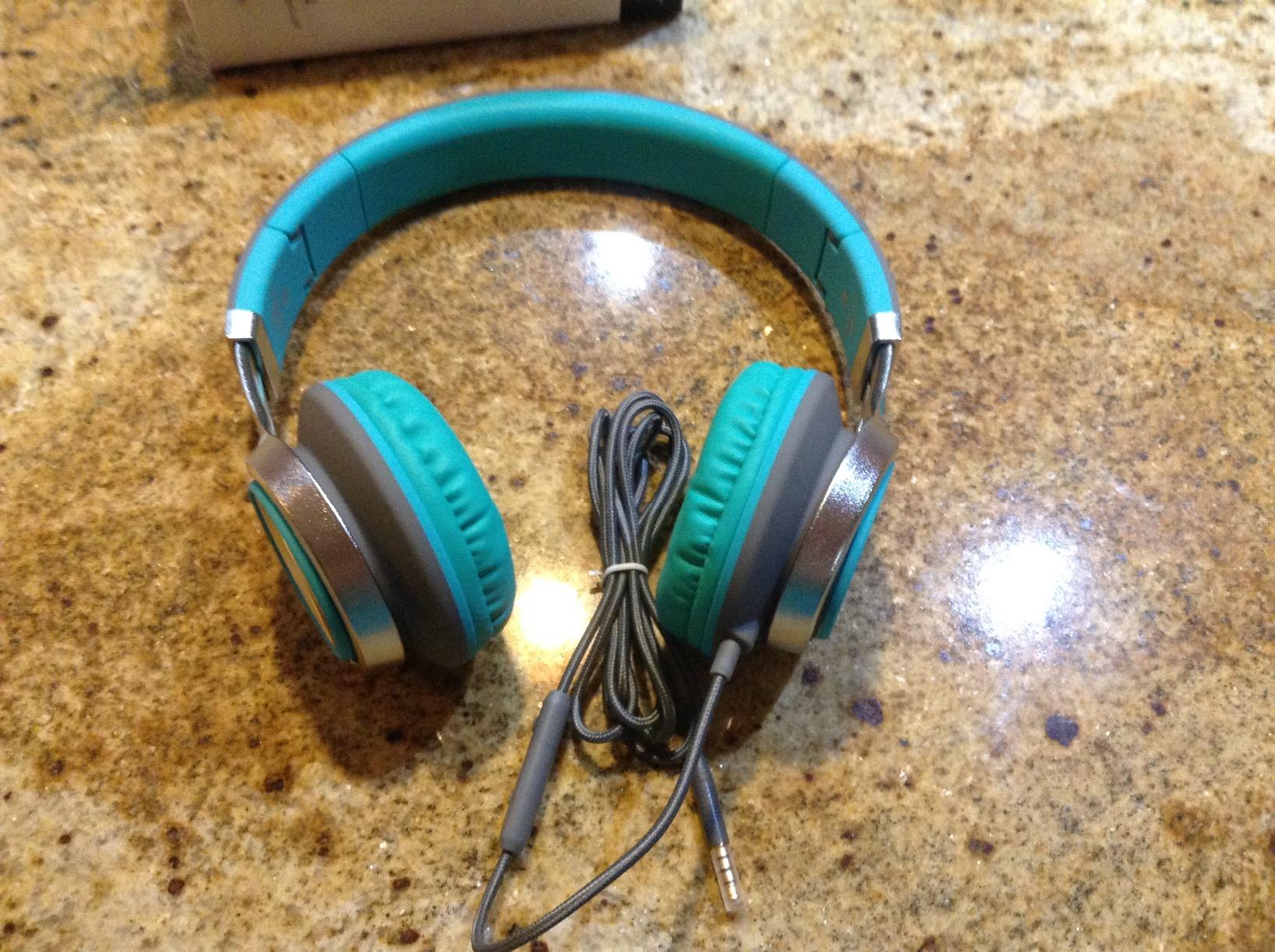 AILIHEN C8 headphones sitting on a counter