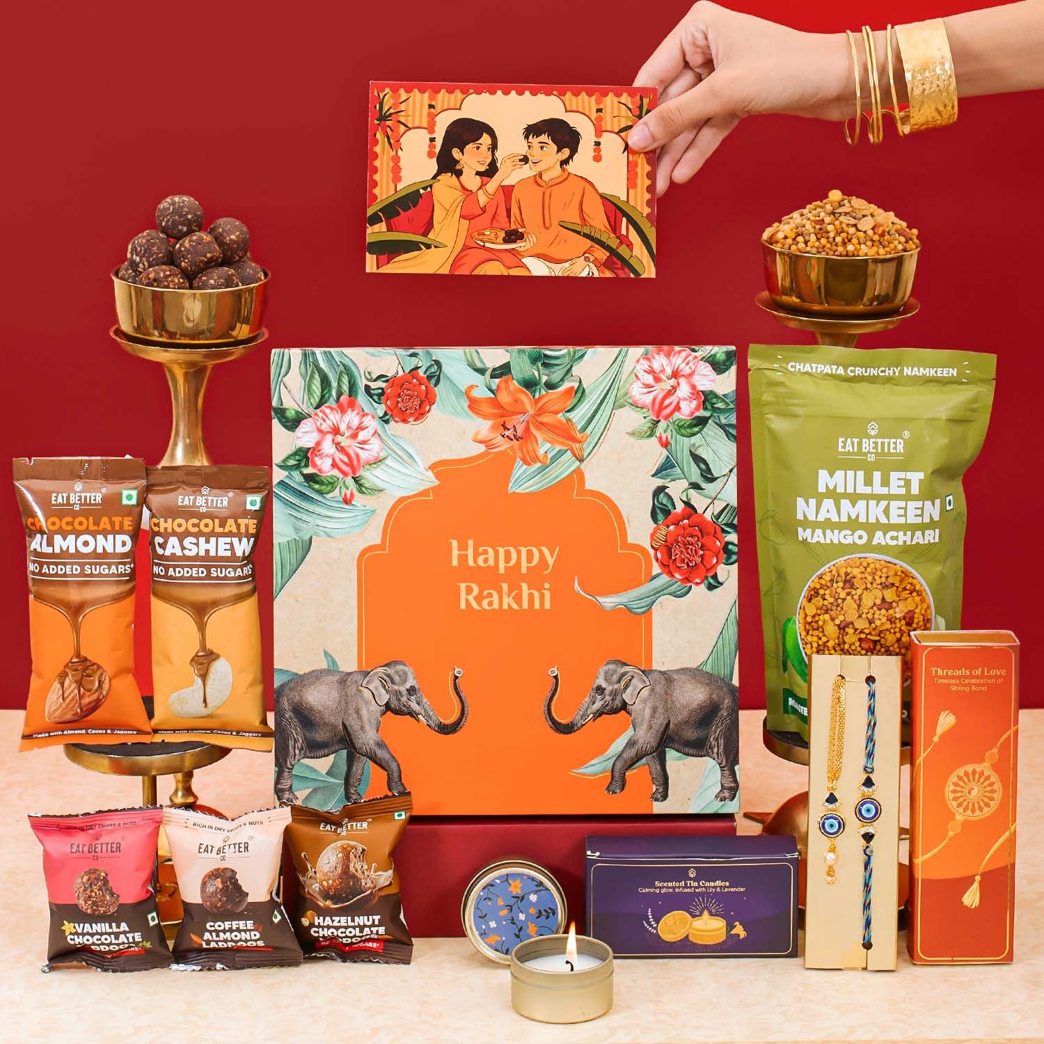 Rakhi Gift Hamper for Bhayia & Bhabhi – 11-Item Combo with Evil Eye Rakhi & Bracelet, Chocolate Laddoos, Millet Namkeen, Cranberries, Daily Planner & Roli Chawal | Raksha Bandhan Gift Box-image-36