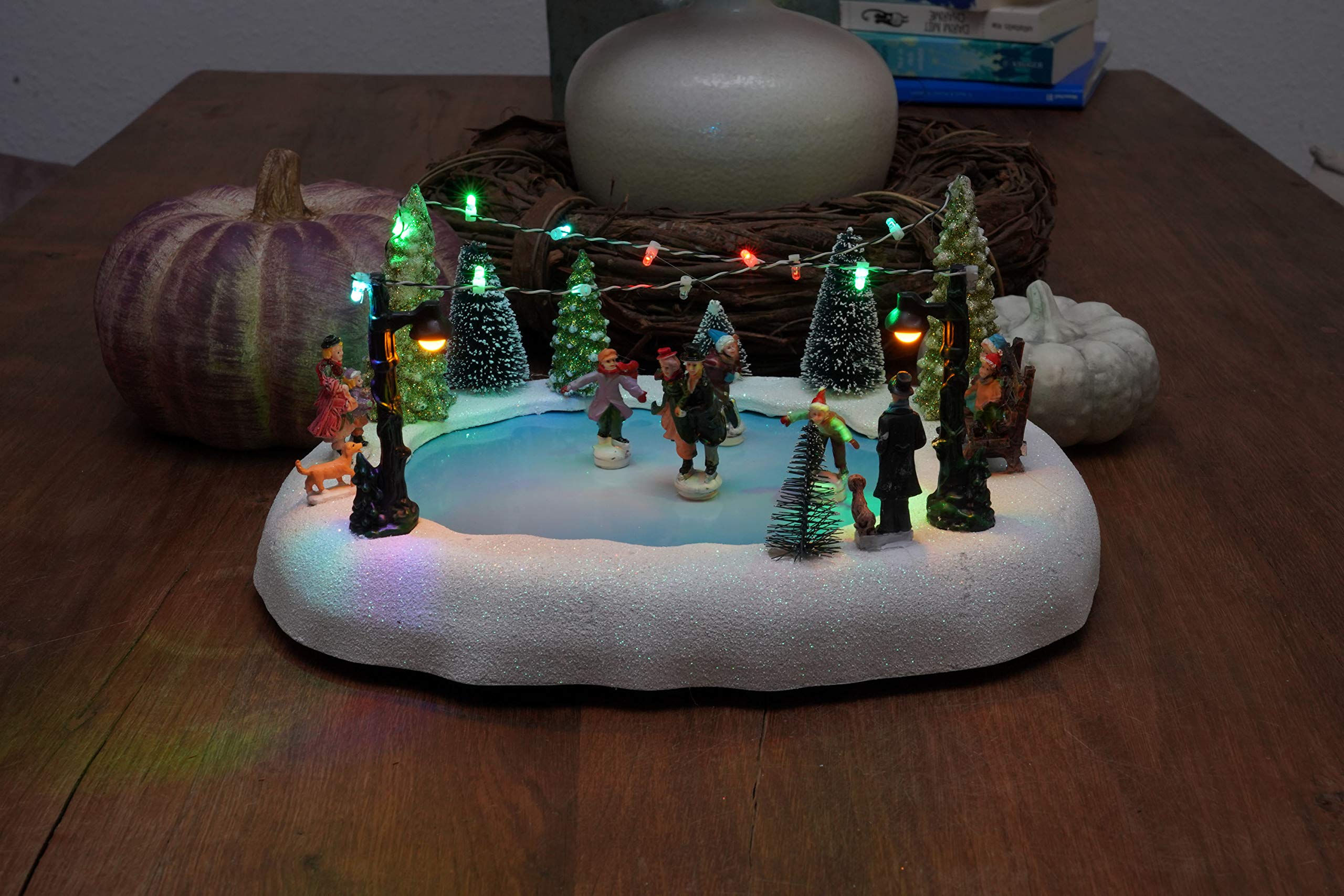 Spetebo Scène de Noël LED - Patinoire avec figurines mobiles - Décoration de table - Décoration de Noël éclairée