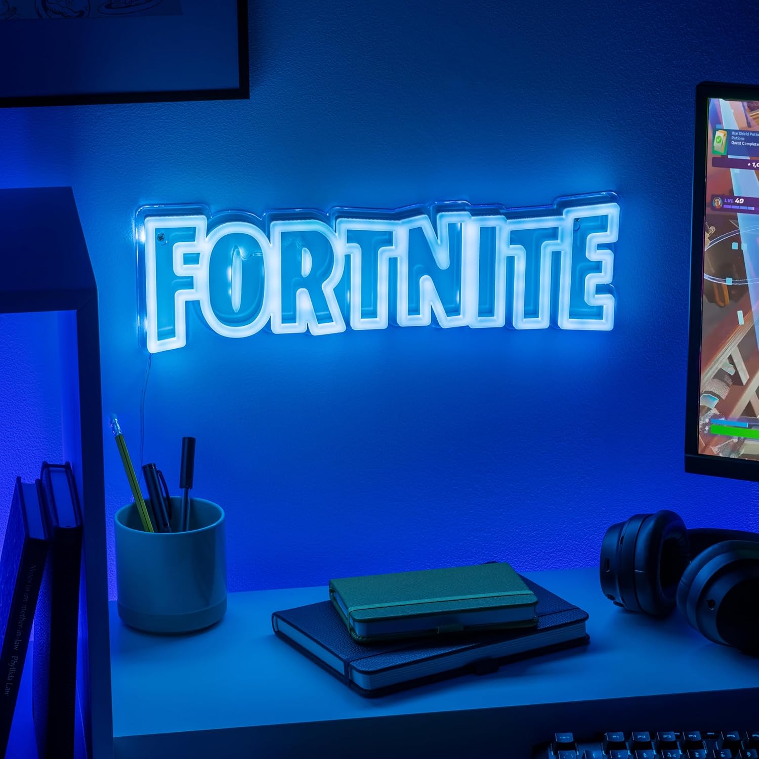 Fortnite LED light mounted on a wall in a gaming room