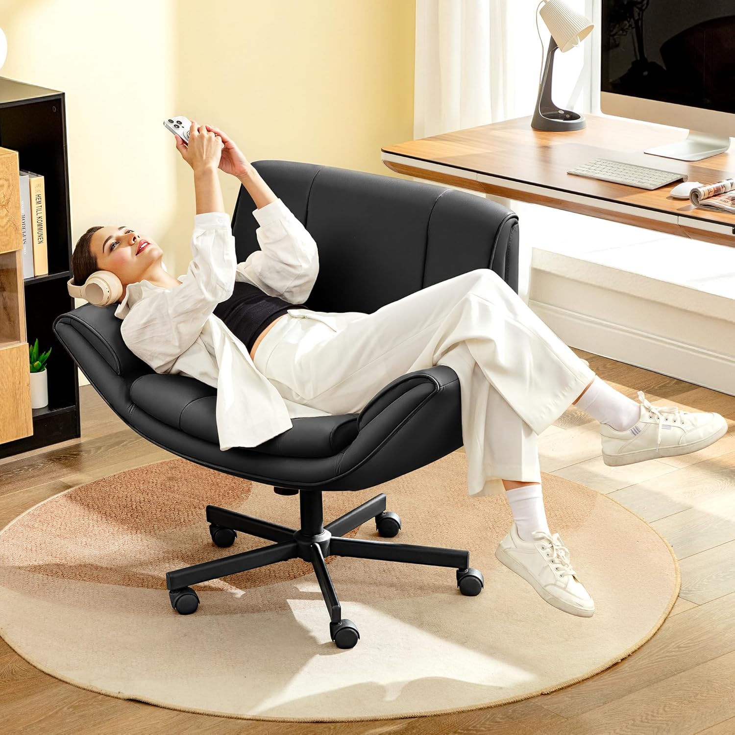 Woman resting in the chair with armrests extended.