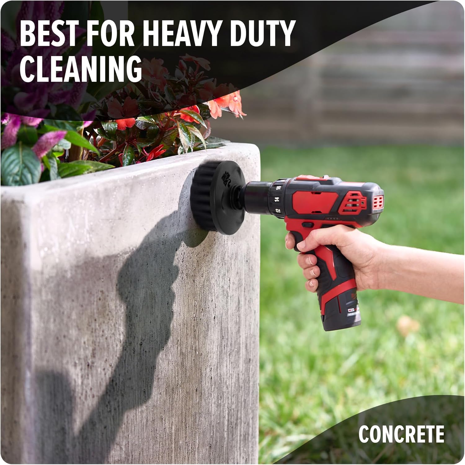 A Dirt Devil hard bristle brush attached to a drill cleaning a concrete planter.