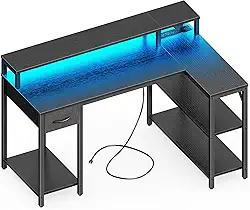 SUPERJARE Mesa de jogos reversível em forma de L com gaveta, luzes LED e tomadas, mesa de canto para computador com prateleiras e suporte de monitor para casa, escritório, preto, 119 cm