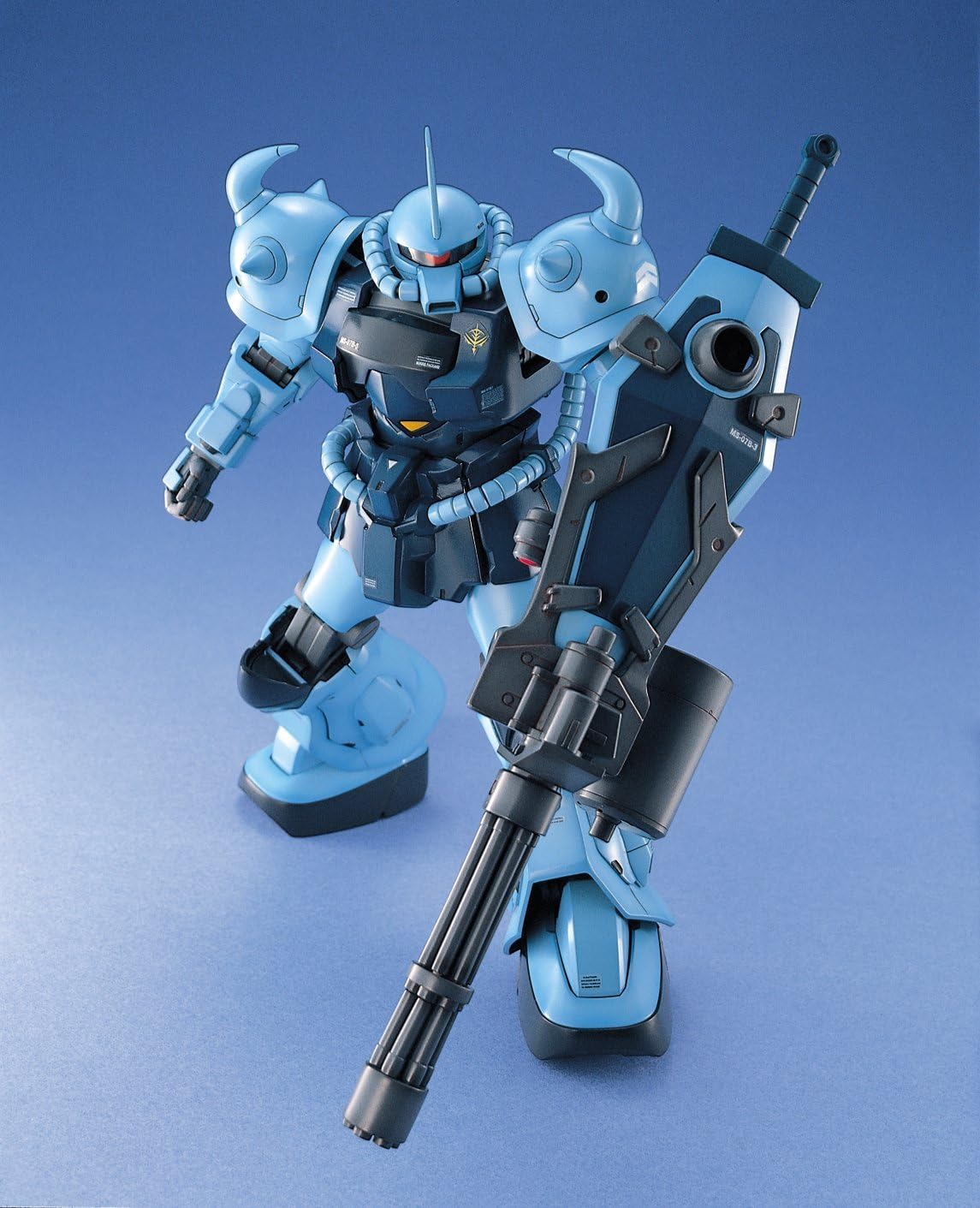 Bandai Hobby MS-07B-3 Gouf Custom MG 1/100 model kit in a dynamic pose, holding its large gatling shield.