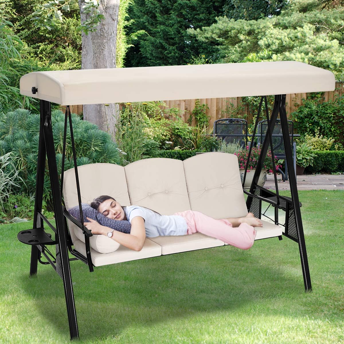 Image of a person comfortably lying on the swing chair in its bed configuration