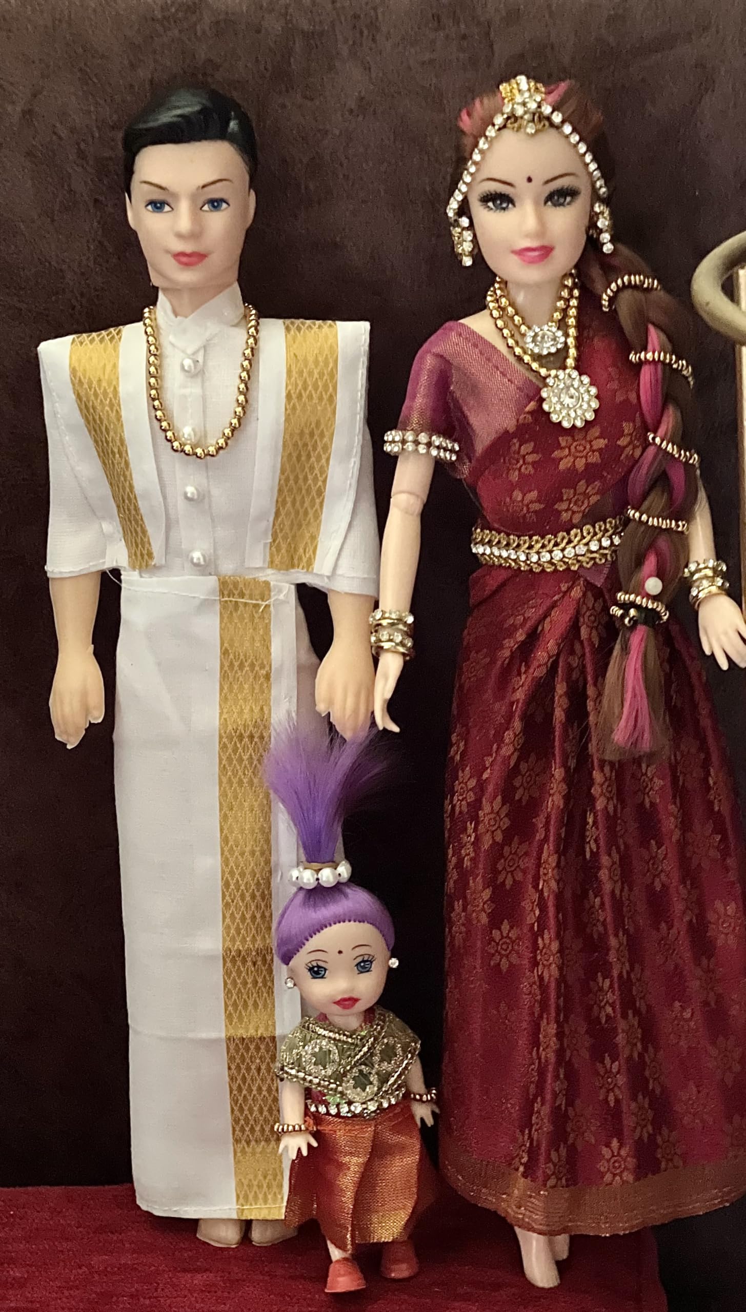 Indian traditional family of Bride in saree and groom in dhoti with a kid. Decorative Showpiece - 33 cm (Plastic, Red)