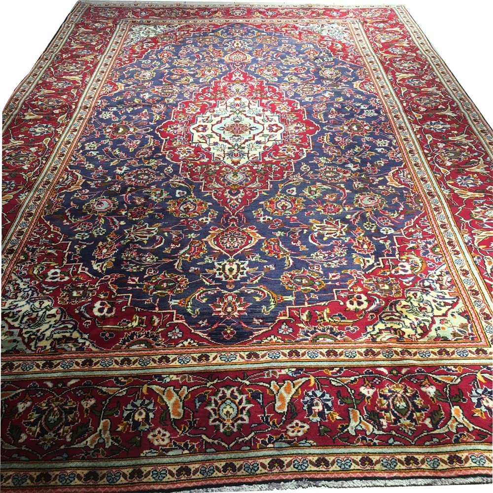 Tapis fait main en laine 190x305 pour isoler un salon froid au sol