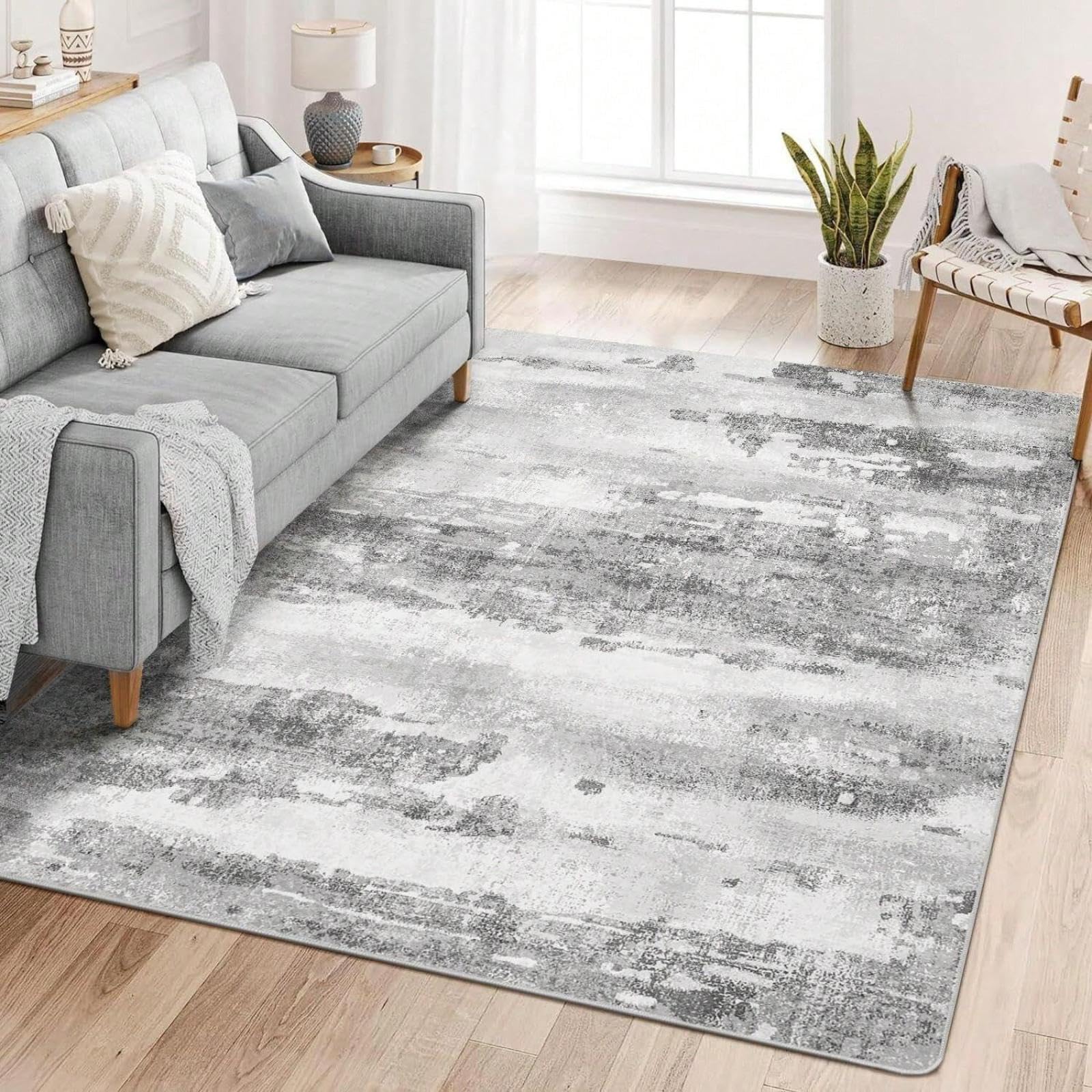 Tapis lavable en machine pour salon fini les taches avec ce grand tapis gris