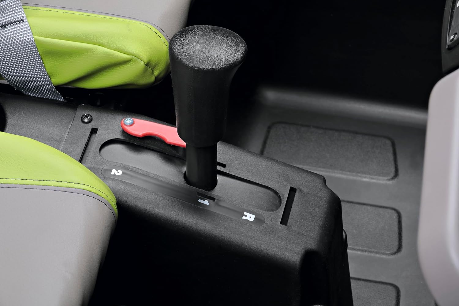 Close-up of the gear shifter with 1, 2, and R positions