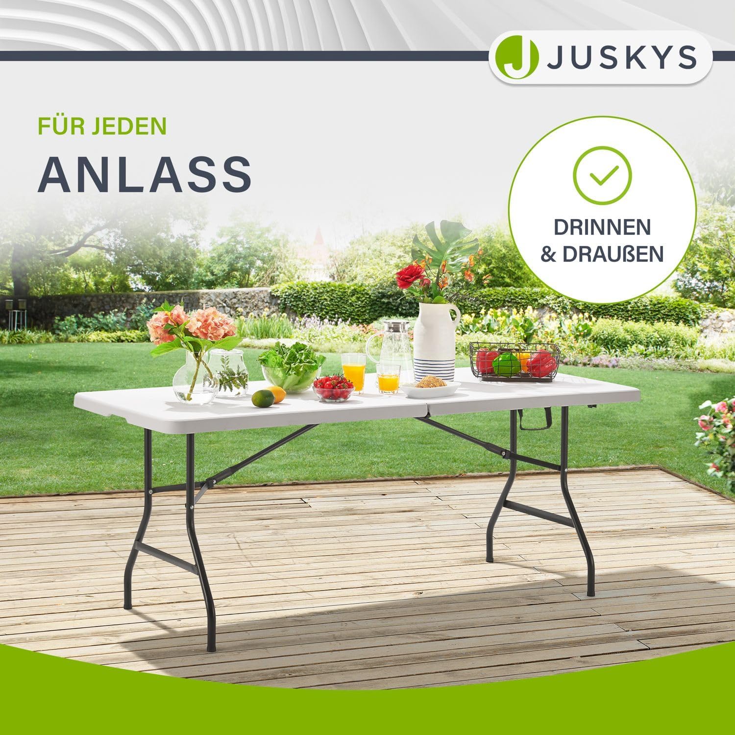Juskys XL Foldable Buffet Table set up outdoors on a deck with food and drinks, illustrating its suitability for indoor and outdoor use.