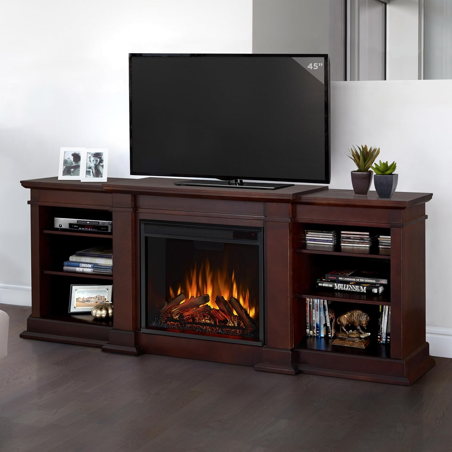 Real Flame Fresno 72-inch TV Stand in Dark Walnut with a television placed on top, showcasing its use as an entertainment center.