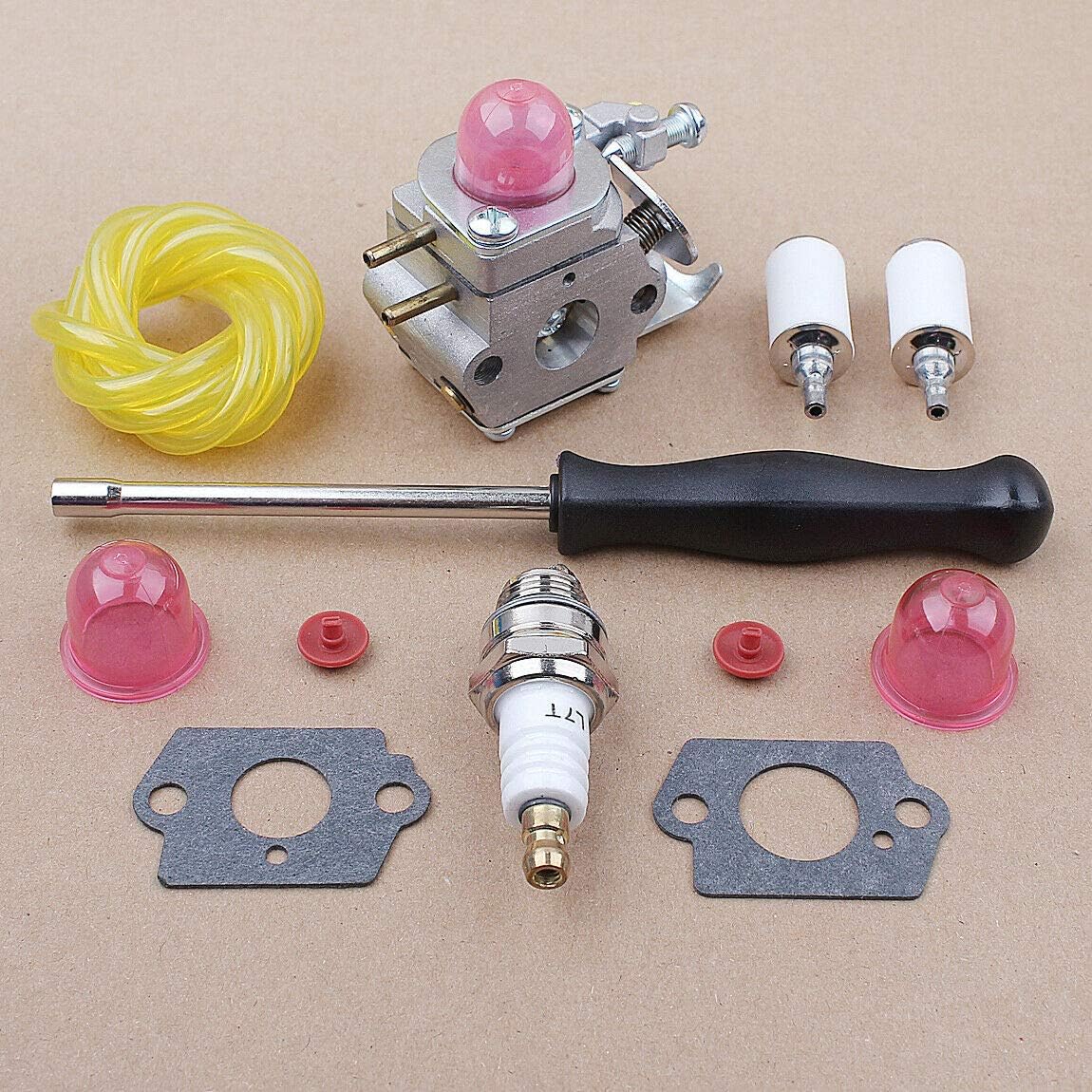 Carburetor with visible adjustment screws and fuel line connections