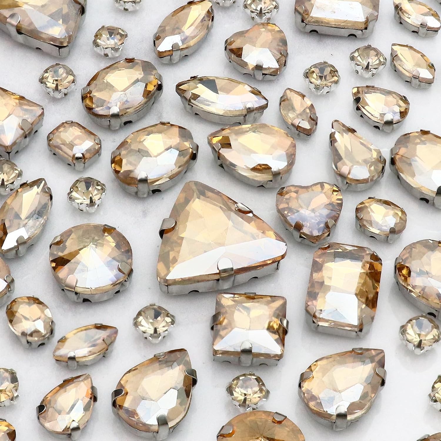 Dowarm Sew on Rhinestones 104 PCS Mixed Shapes Glass Sew on Crystals for Crafts Metal Flatback Claw Gemstones for Jewelry Making Costumes Clothes Garment, Golden Shadow/Champagne