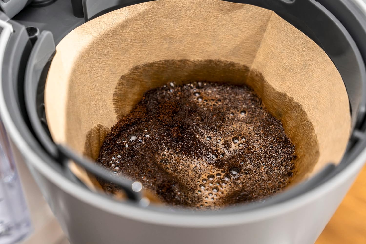 Coffee grounds blooming in the filter basket of the ZWILLING Enfinigy coffee maker.