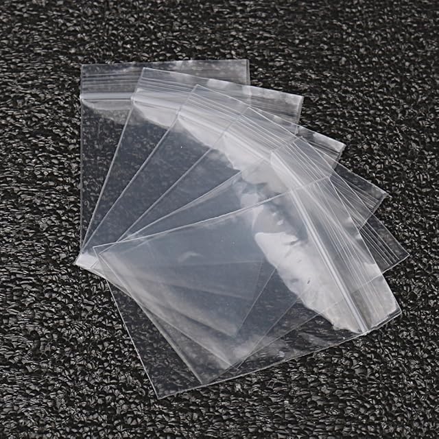 nuoshen Plastic Seal Bags, 100 pcs Small Clear Storage Pouches Resealable Poly Zip Lock Bags for Kitchen Storage, Jewellery, Small Cookies and Sweets(50 x 70mm/2.75 x 1.97 inch)