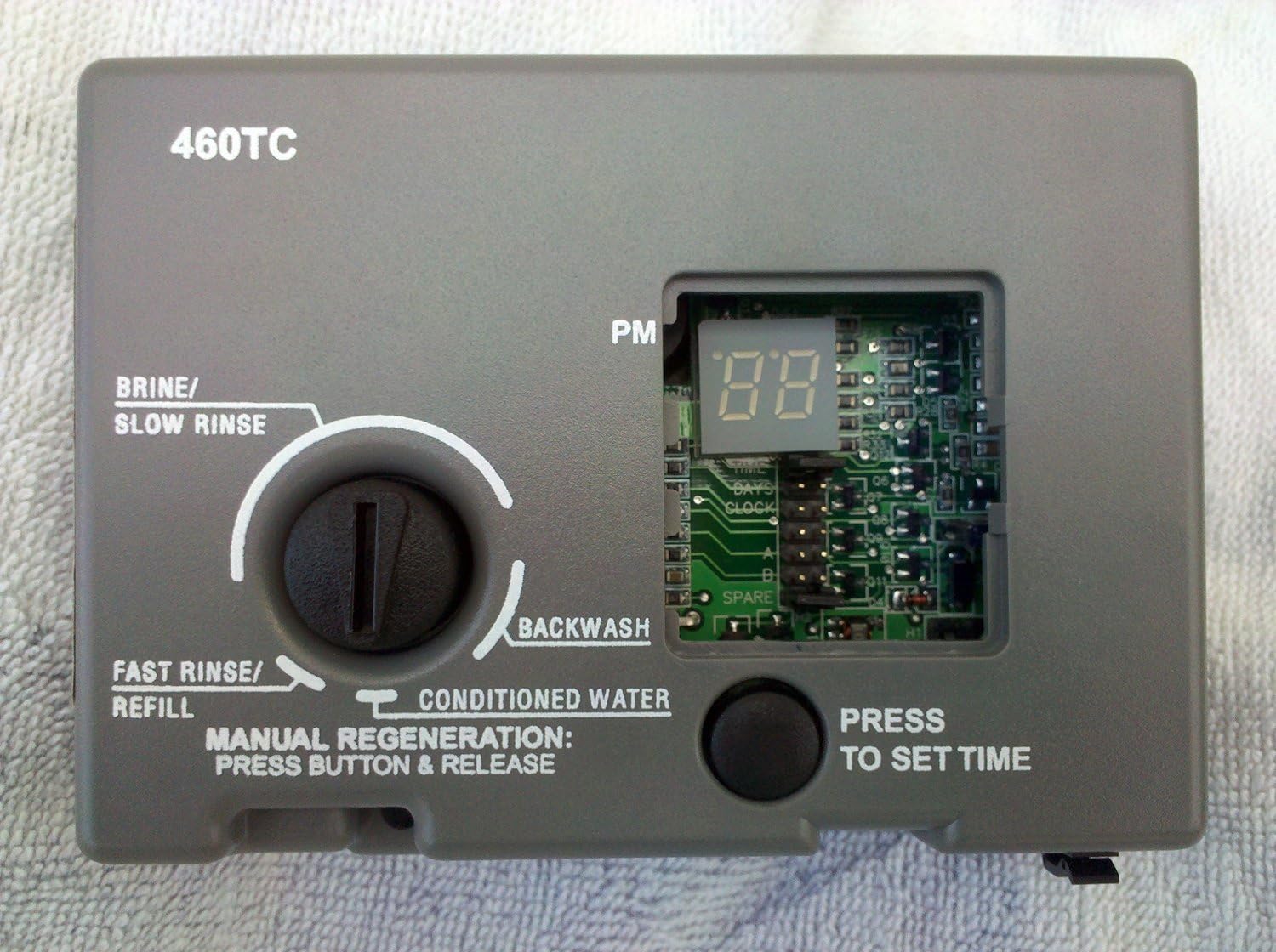 Indre view of the 460TC Timer Assembly circuit board, visible after removing the front cover.