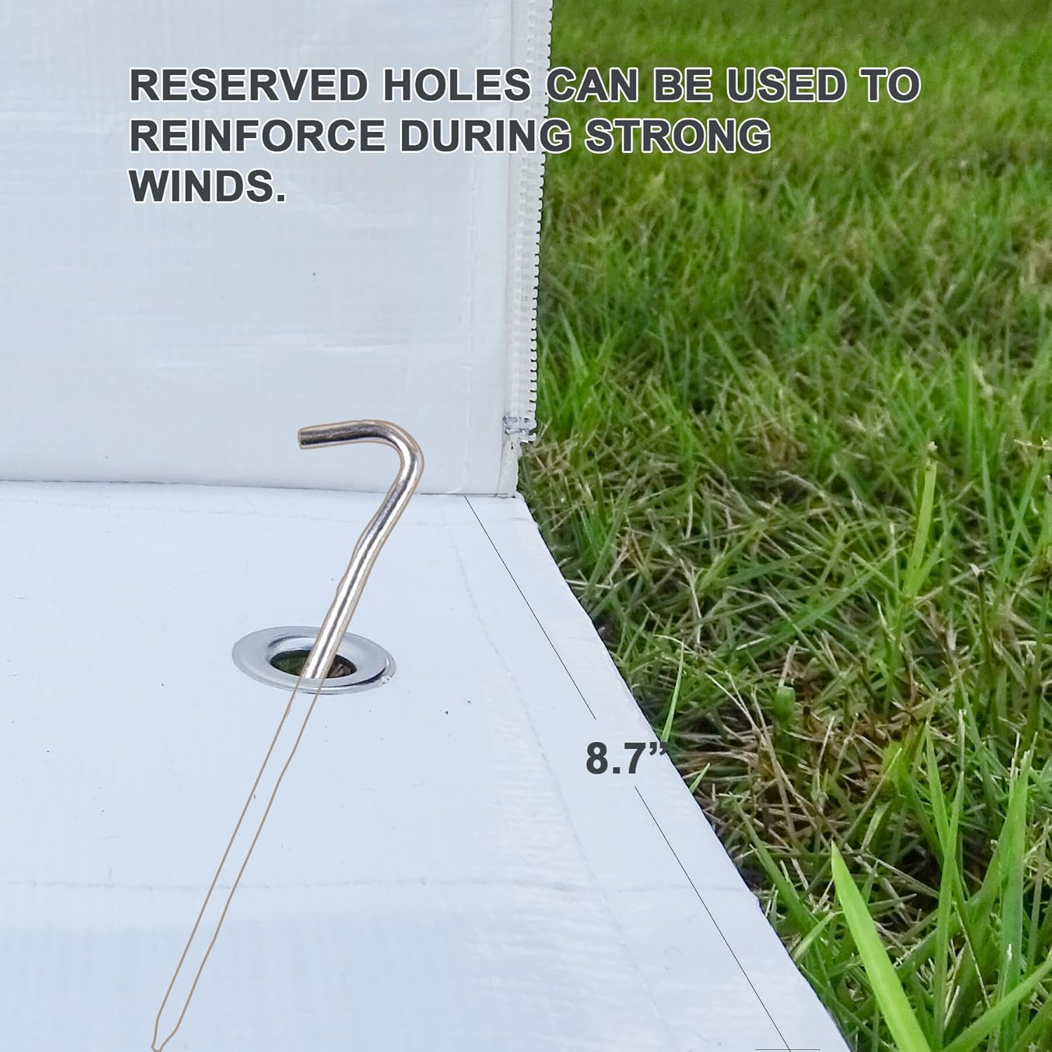 Close-up of pre-drilled hole and stake for wind reinforcement