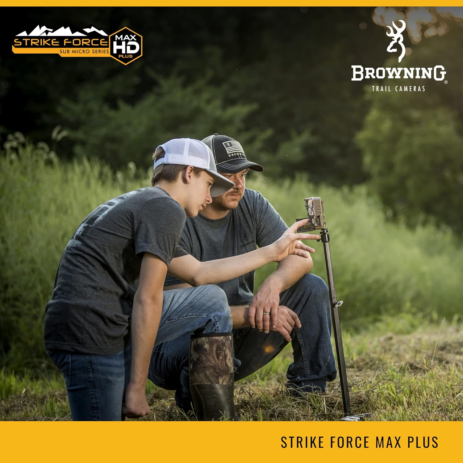 Two individuals setting up a Browning Trail Camera on a stand in an outdoor environment