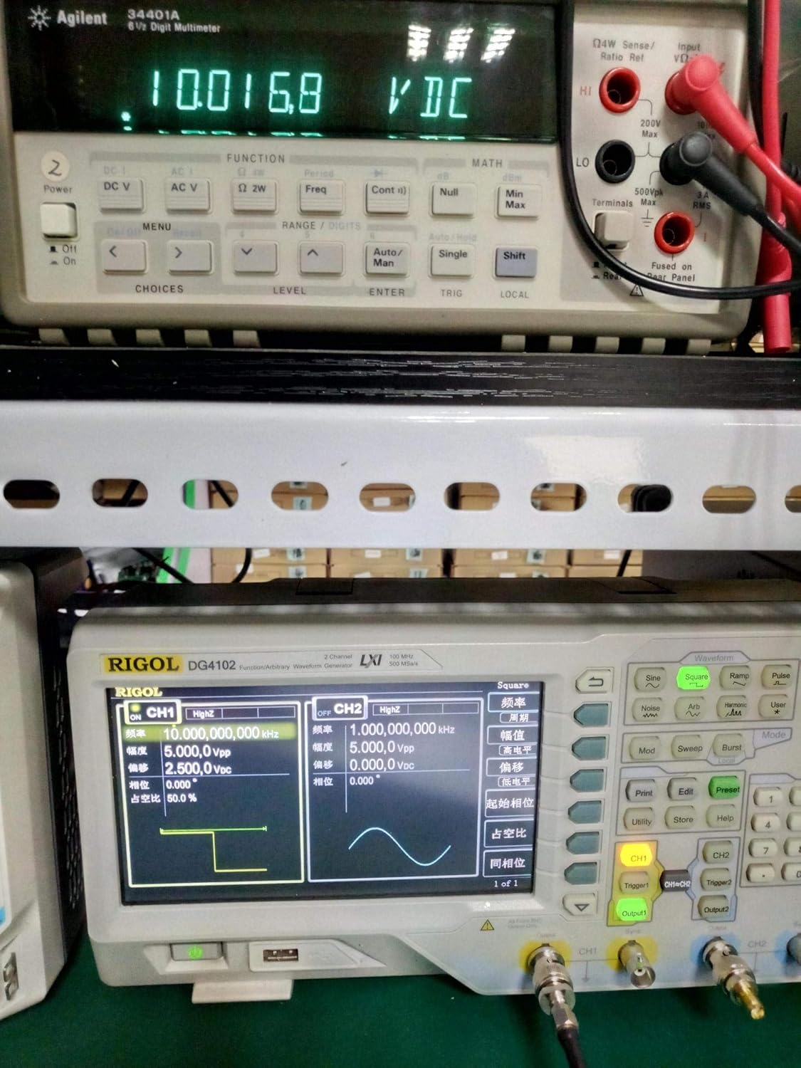Taidacent LM331 module connected to a multimeter displaying 10.0168 VDC and a Rigol DG4102 function generator displaying a square wave output.