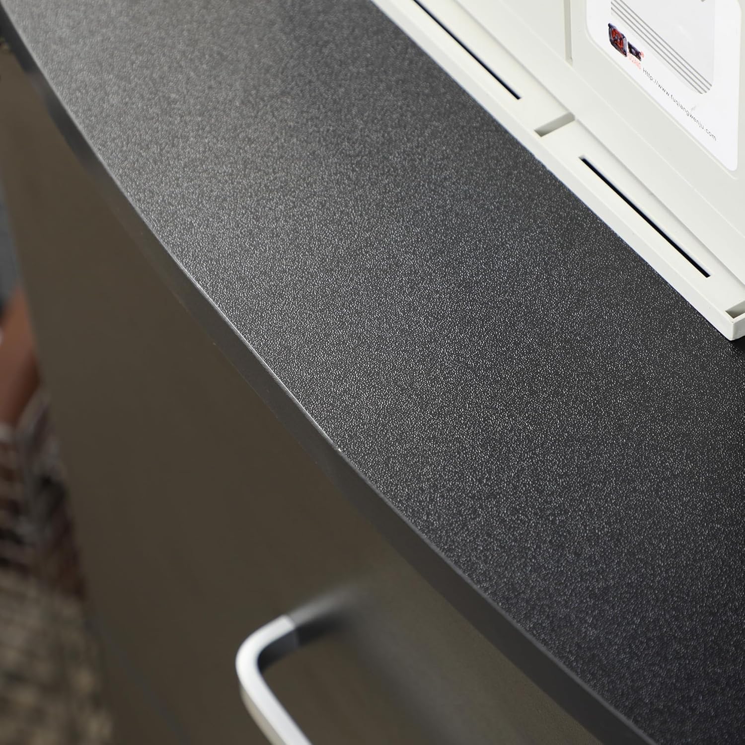 Close-up of the cabinet's melamine surface texture