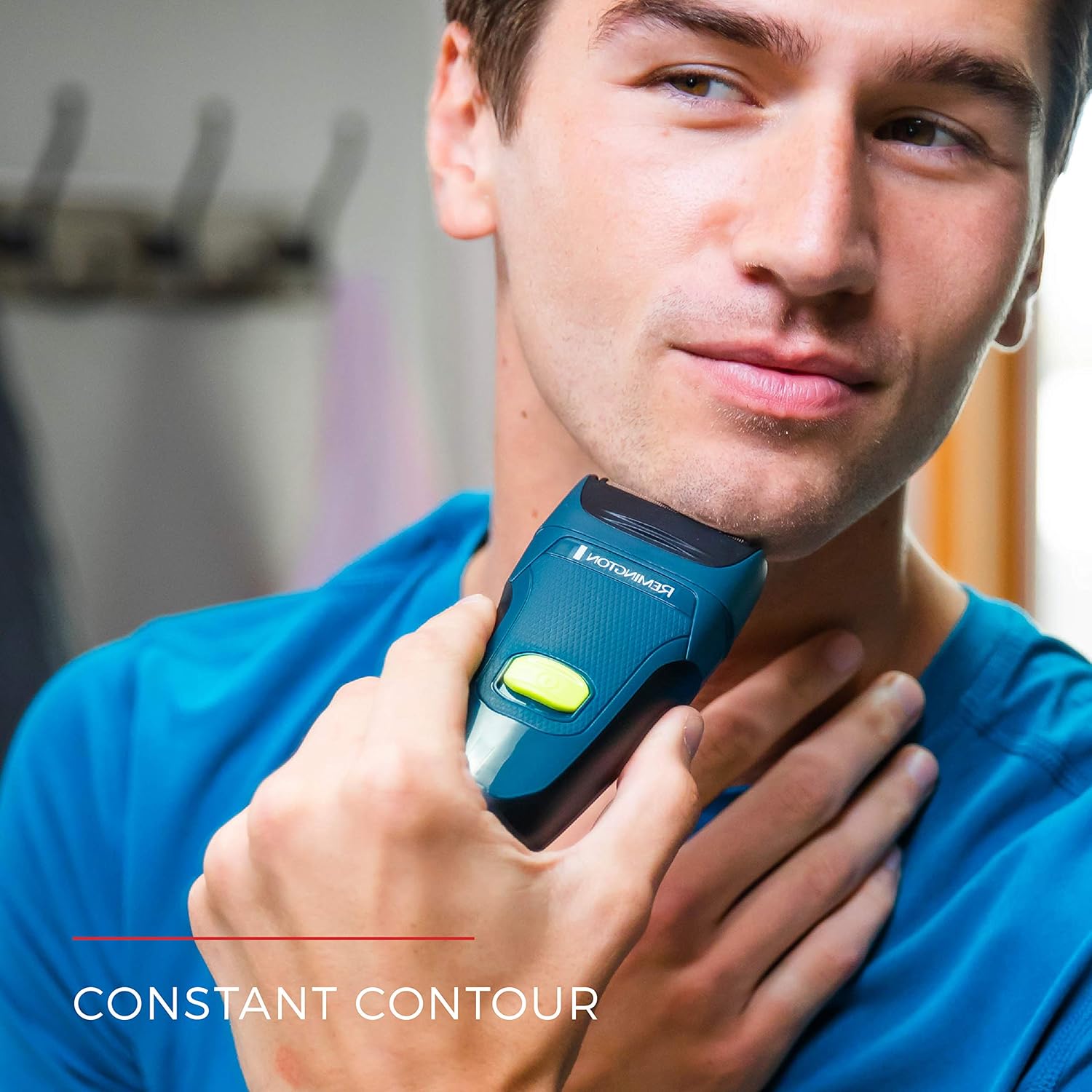 Man using the Remington Ultrastyle Shaver on his jawline, demonstrating constant contour