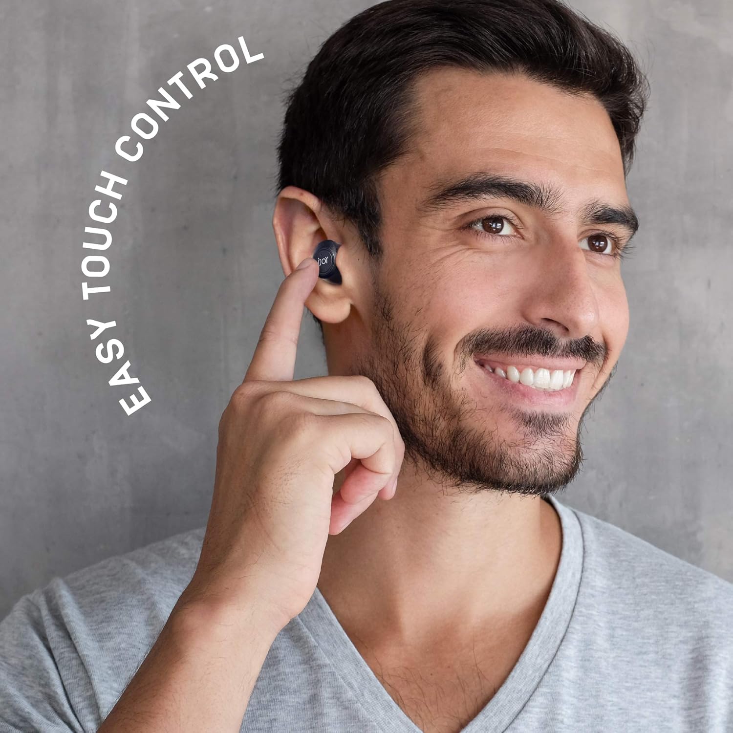 Man using iJoy Gravity TWS Earbuds touch control
