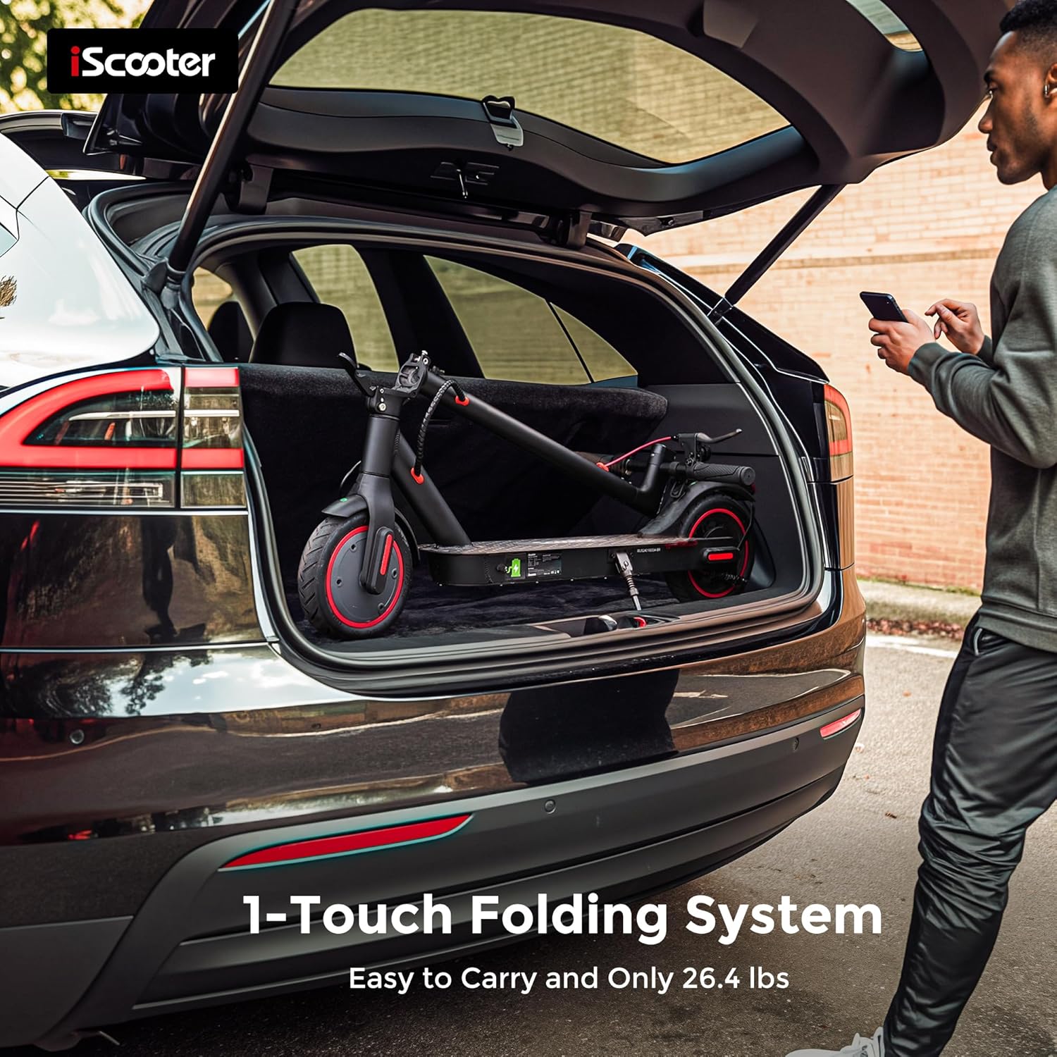 iScooter i8 folded and stored in a car trunk