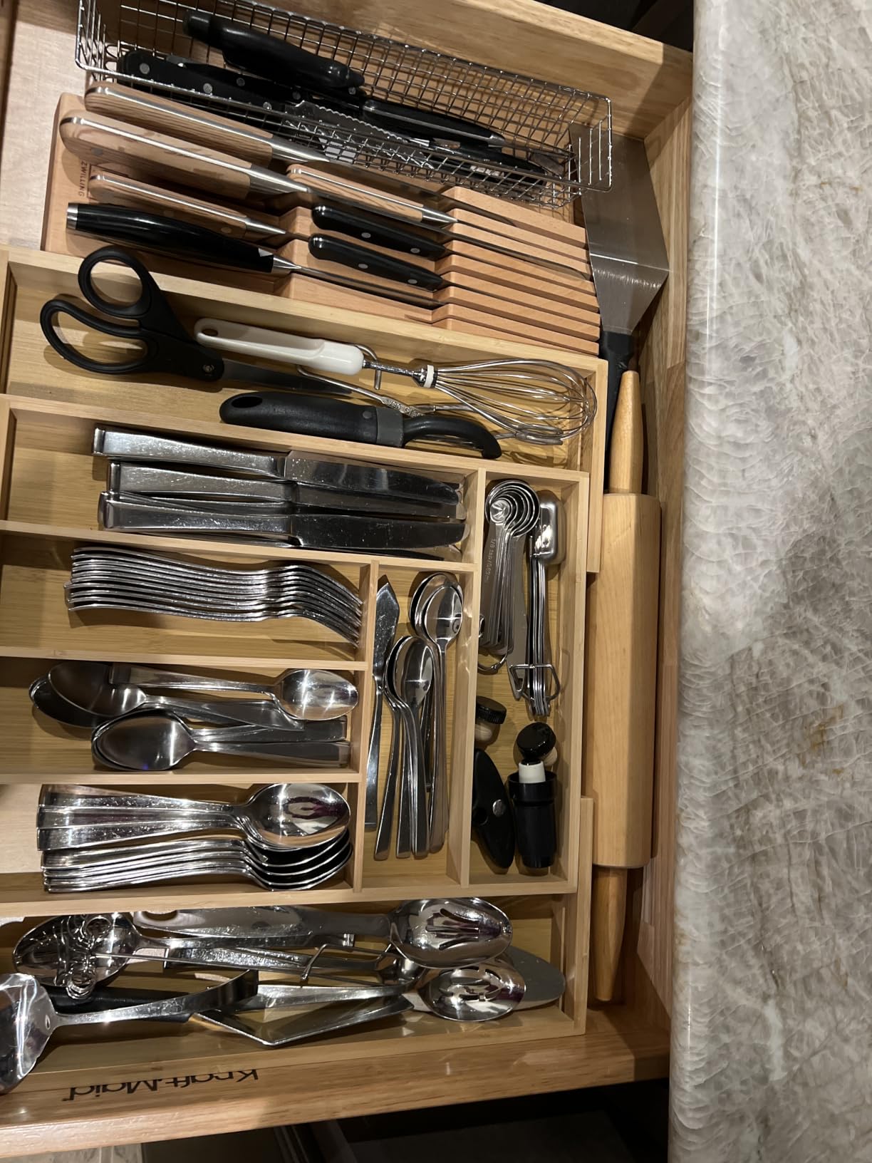 Bamboo expandable utensil organizer holding forks knives and spoons