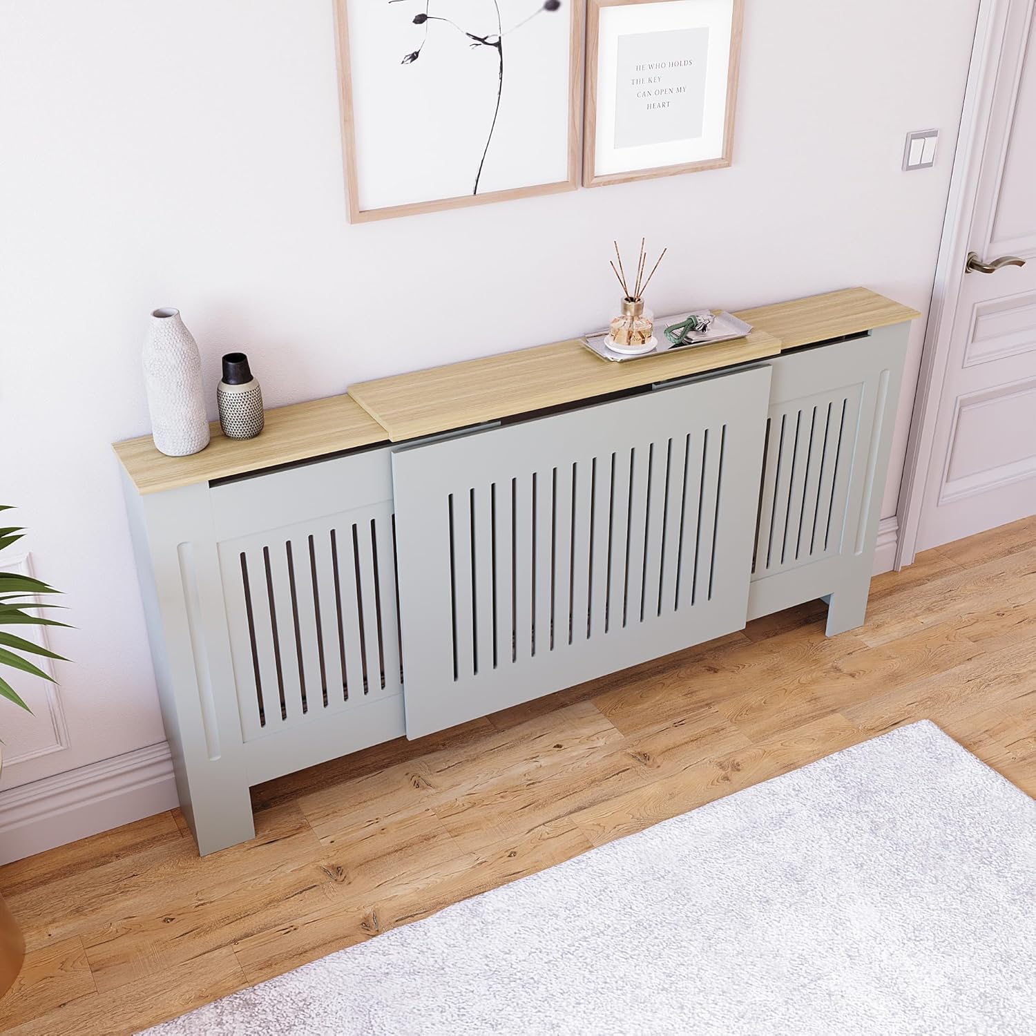 Wider view of the adjustable radiator cover in a room, showcasing its extended width and decorative top surface.